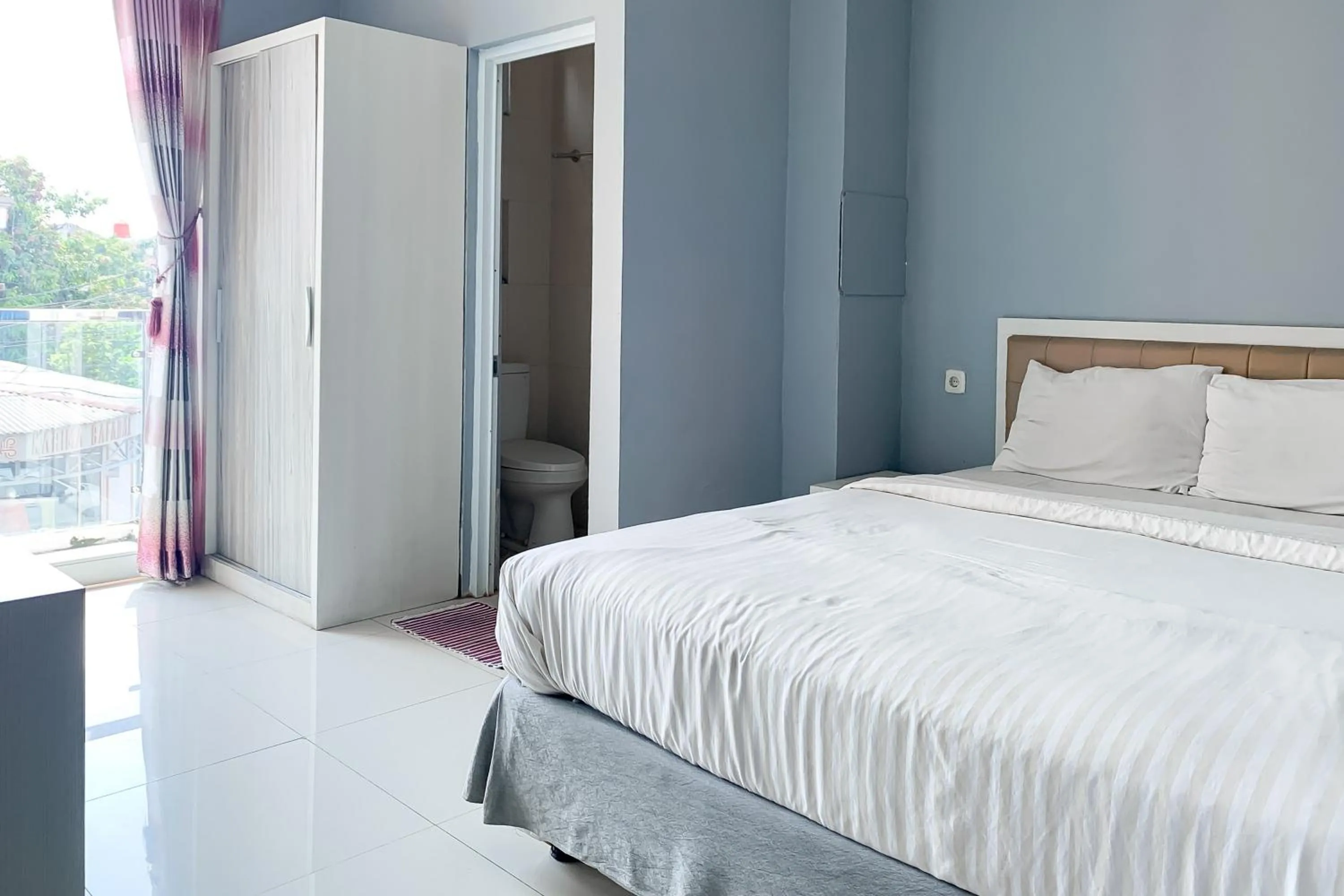 Bedroom, Bed in Karins Guesthouse Syariah RedPartner