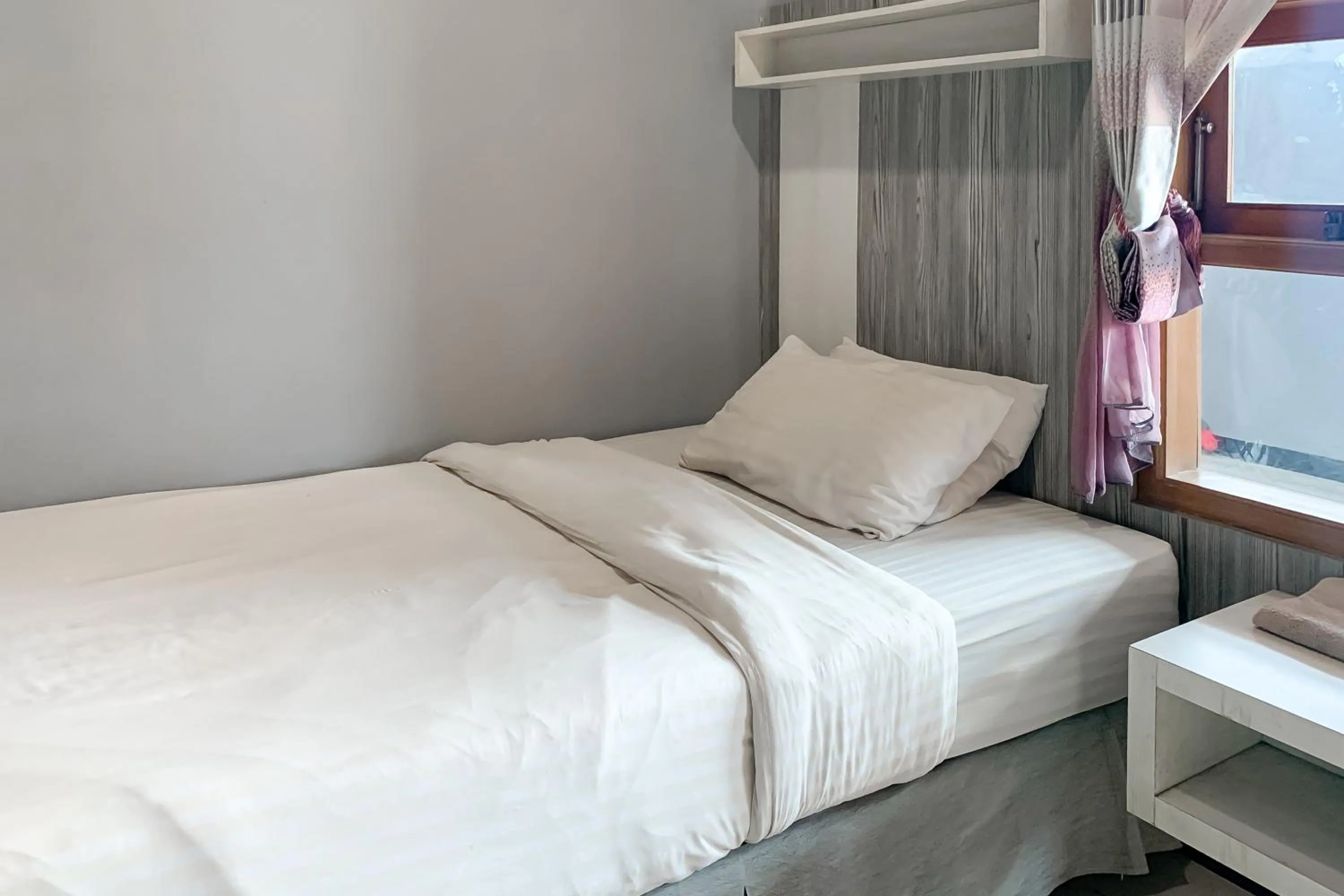 Bed in Karins Guesthouse Syariah RedPartner