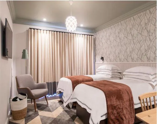 Bed in The Feather Hill Boutique Hotel