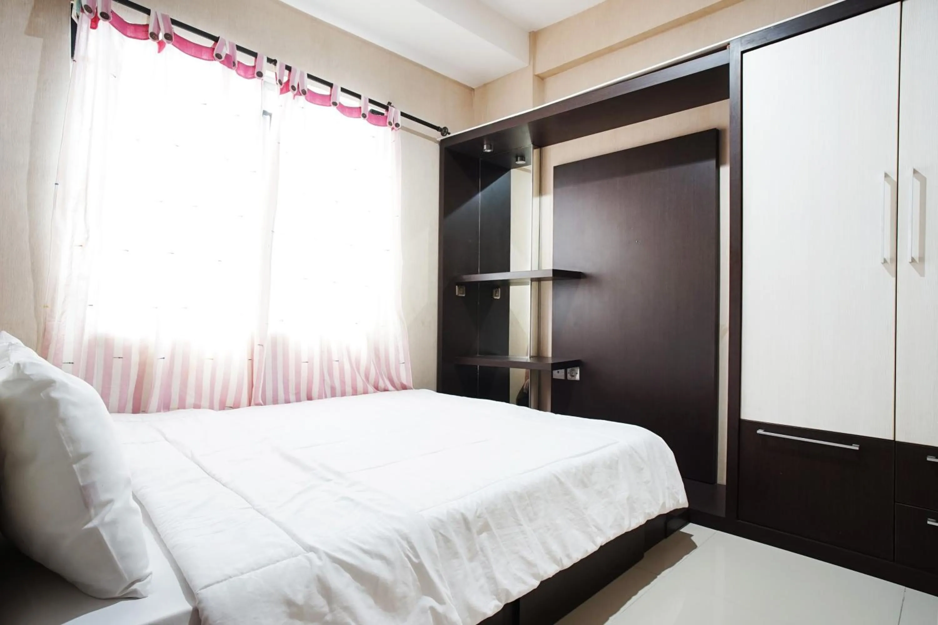 Bed in Kamarku Apartment at The Edge