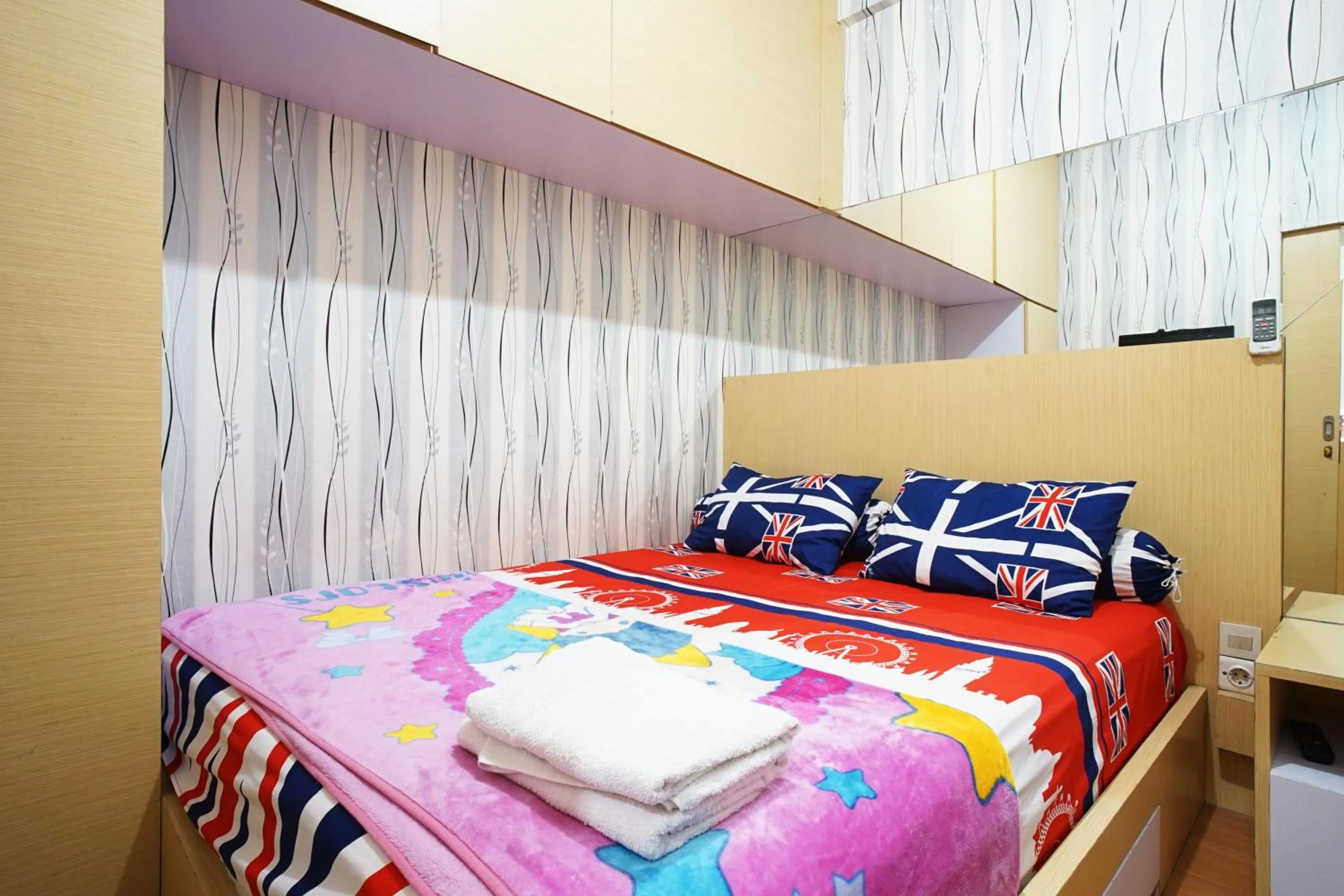 Bed in Kamarku Apartment at The Edge