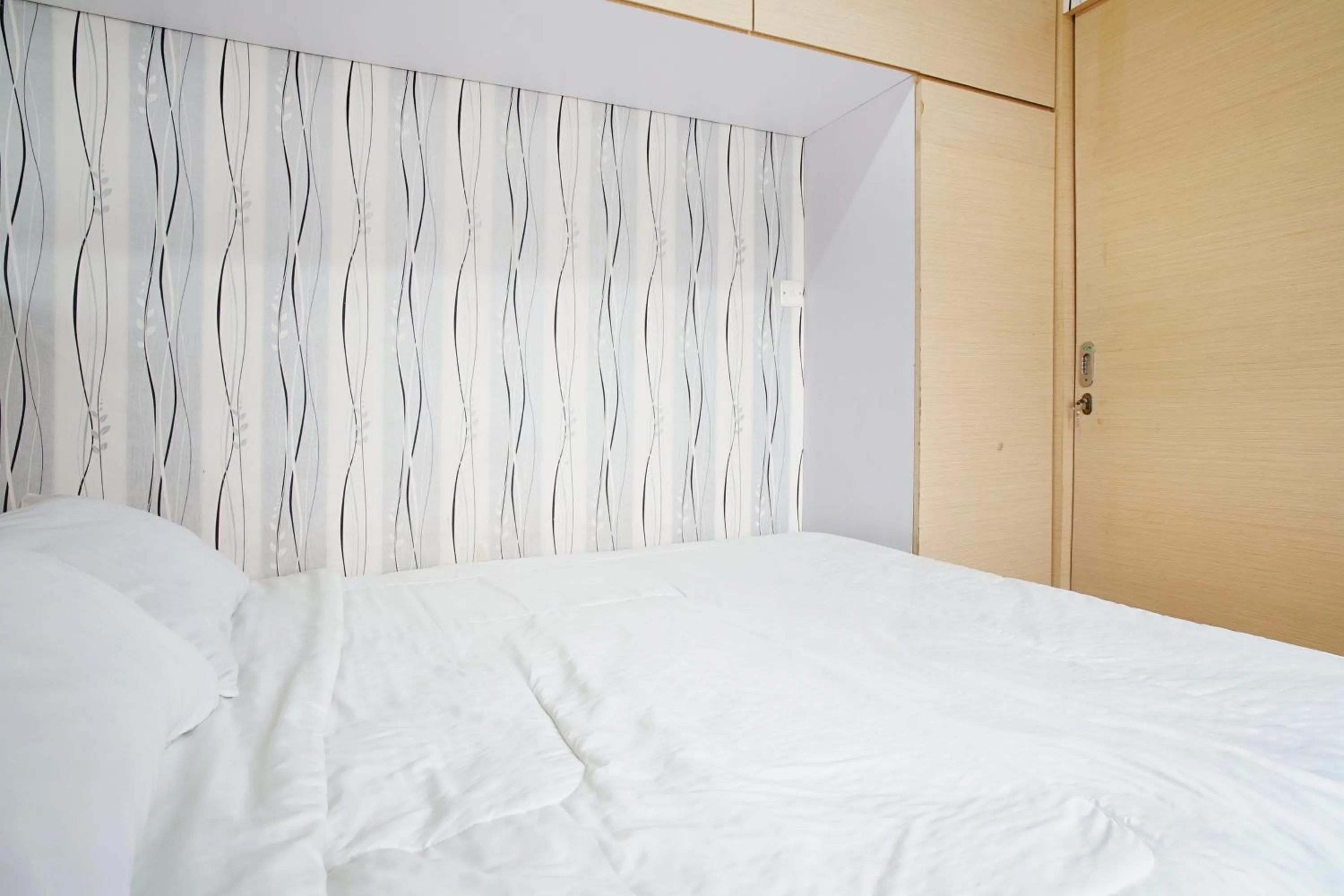 Bed in Kamarku Apartment at The Edge