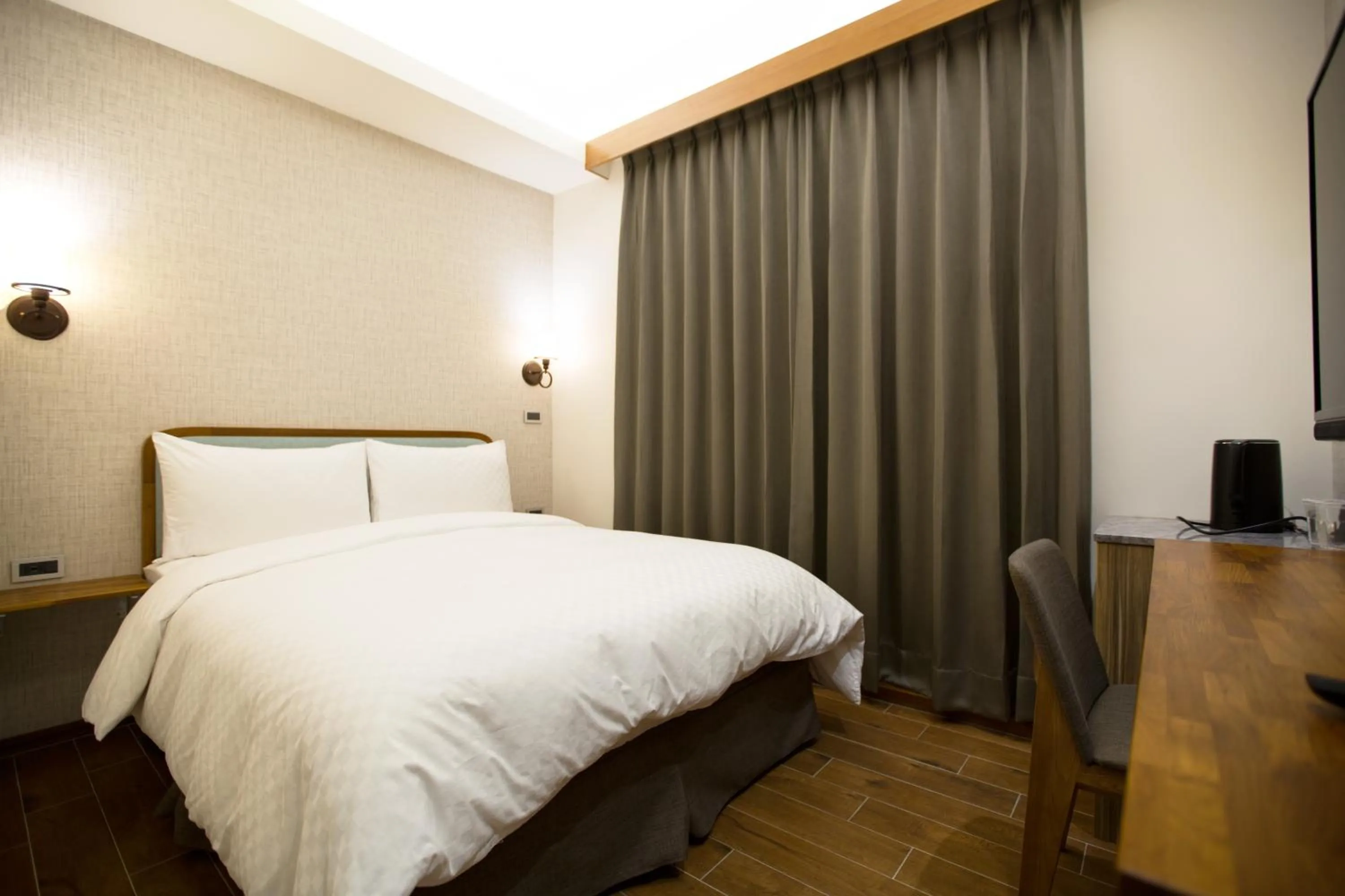 Bed in 原鄉商旅 Yuan Hsiang Hotel