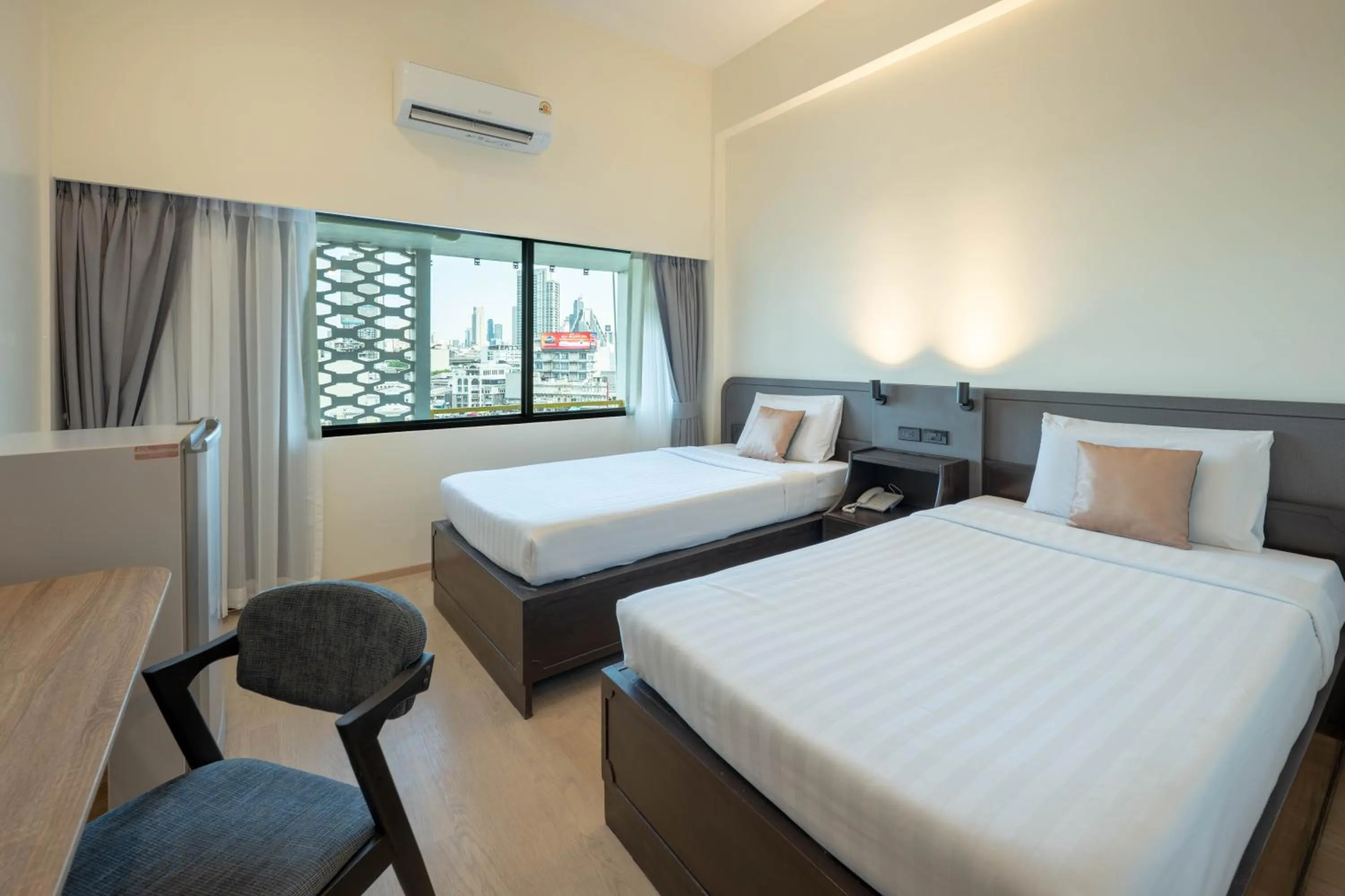 Bed in The Krungkasem Srikrung Hotel