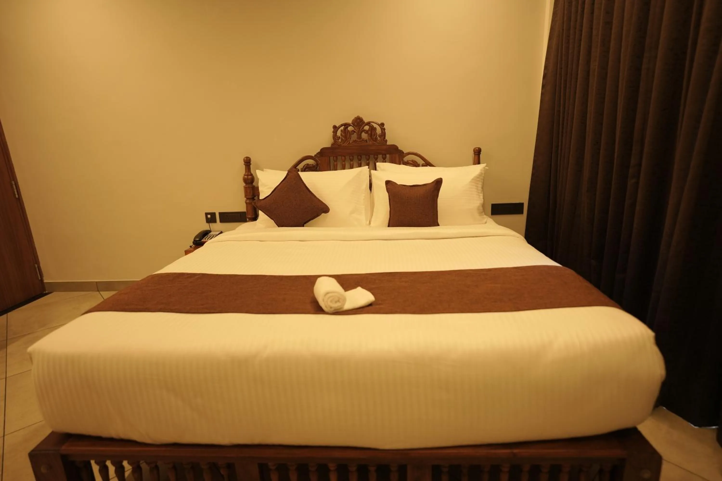 Bed in Aadisaktthi Leisure Resort, Kovalam