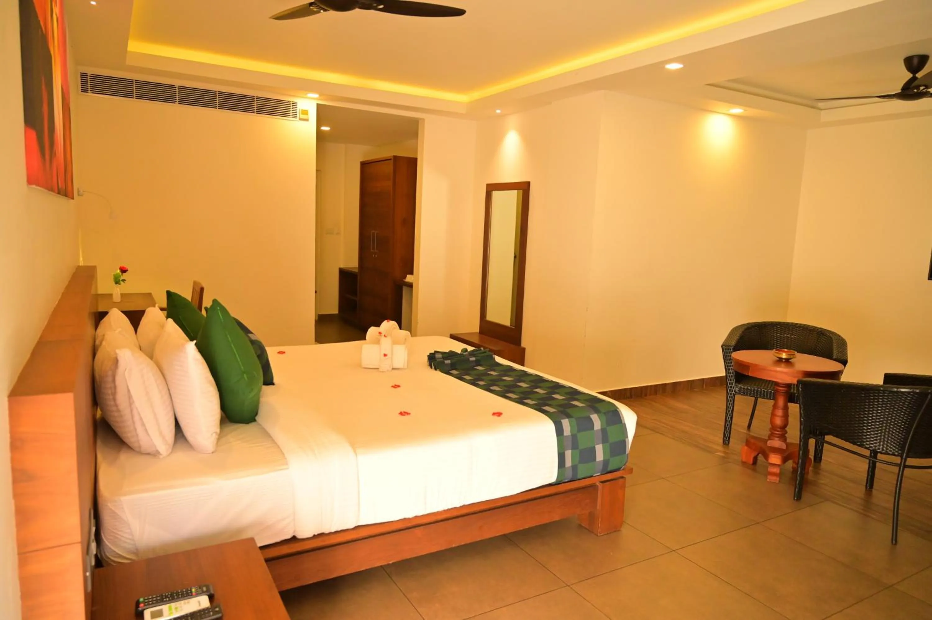 Bed in Aadisaktthi Leisure Resort, Kovalam