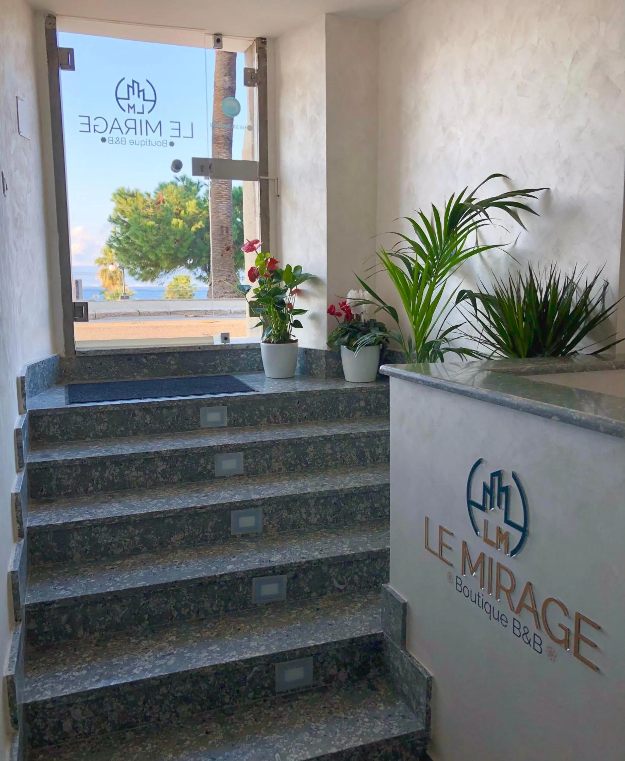 Property logo or sign in Le Mirage boutique II