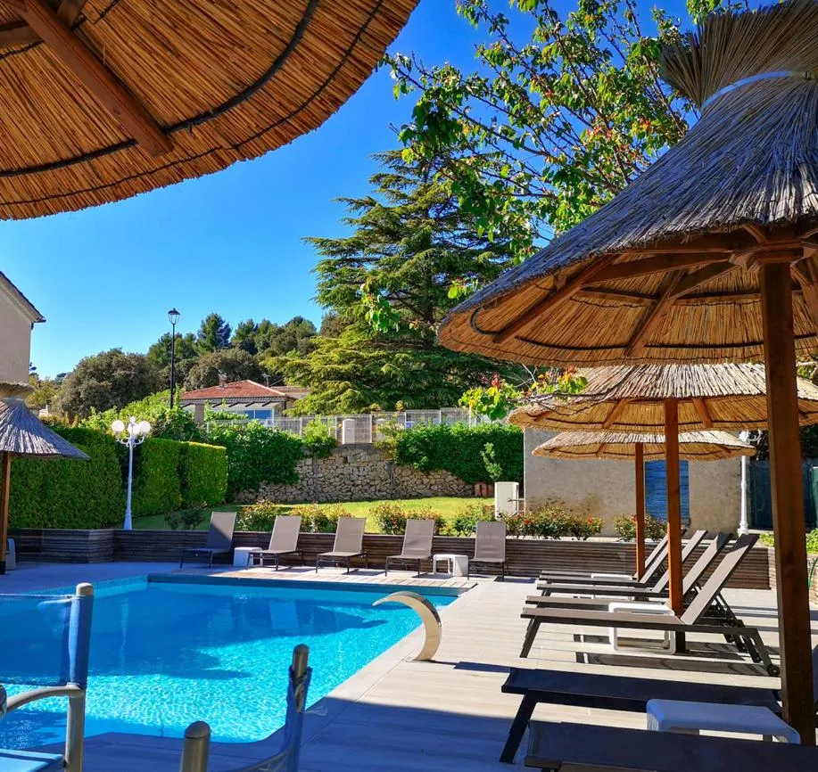 Swimming pool in Hôtel Spa Les Alpes
