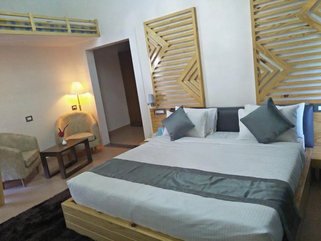 Bed in Clarks Exotica Resort Ramgarh Mukteshwar