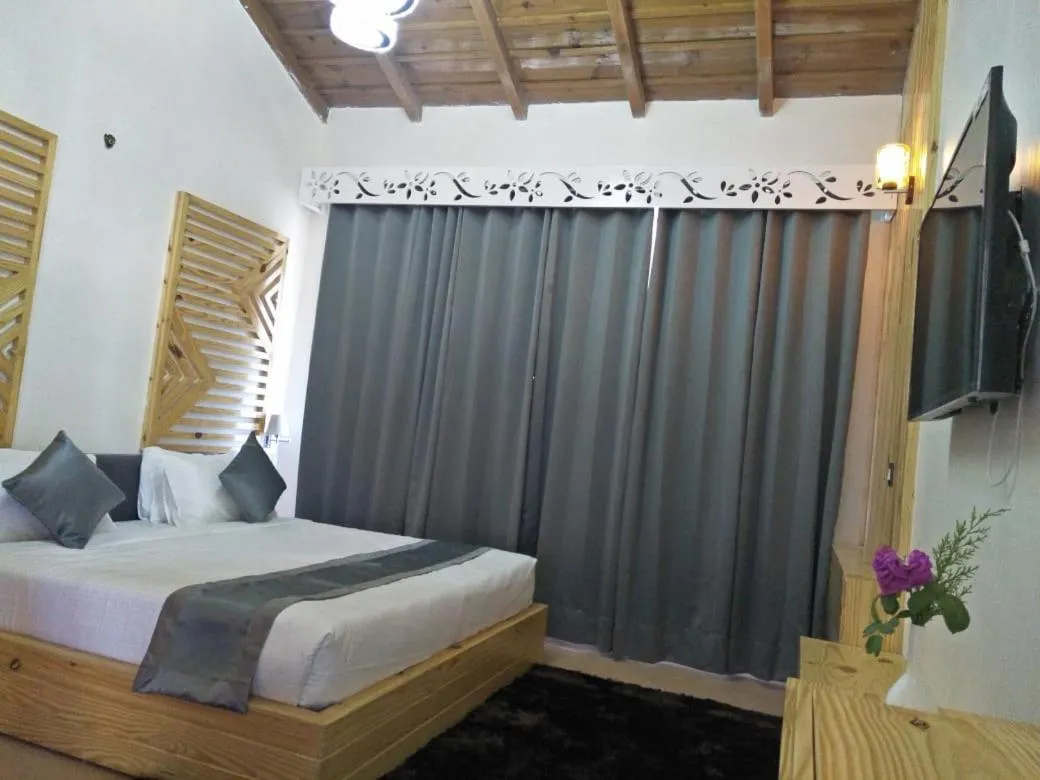Bed in Clarks Exotica Resort Ramgarh Mukteshwar