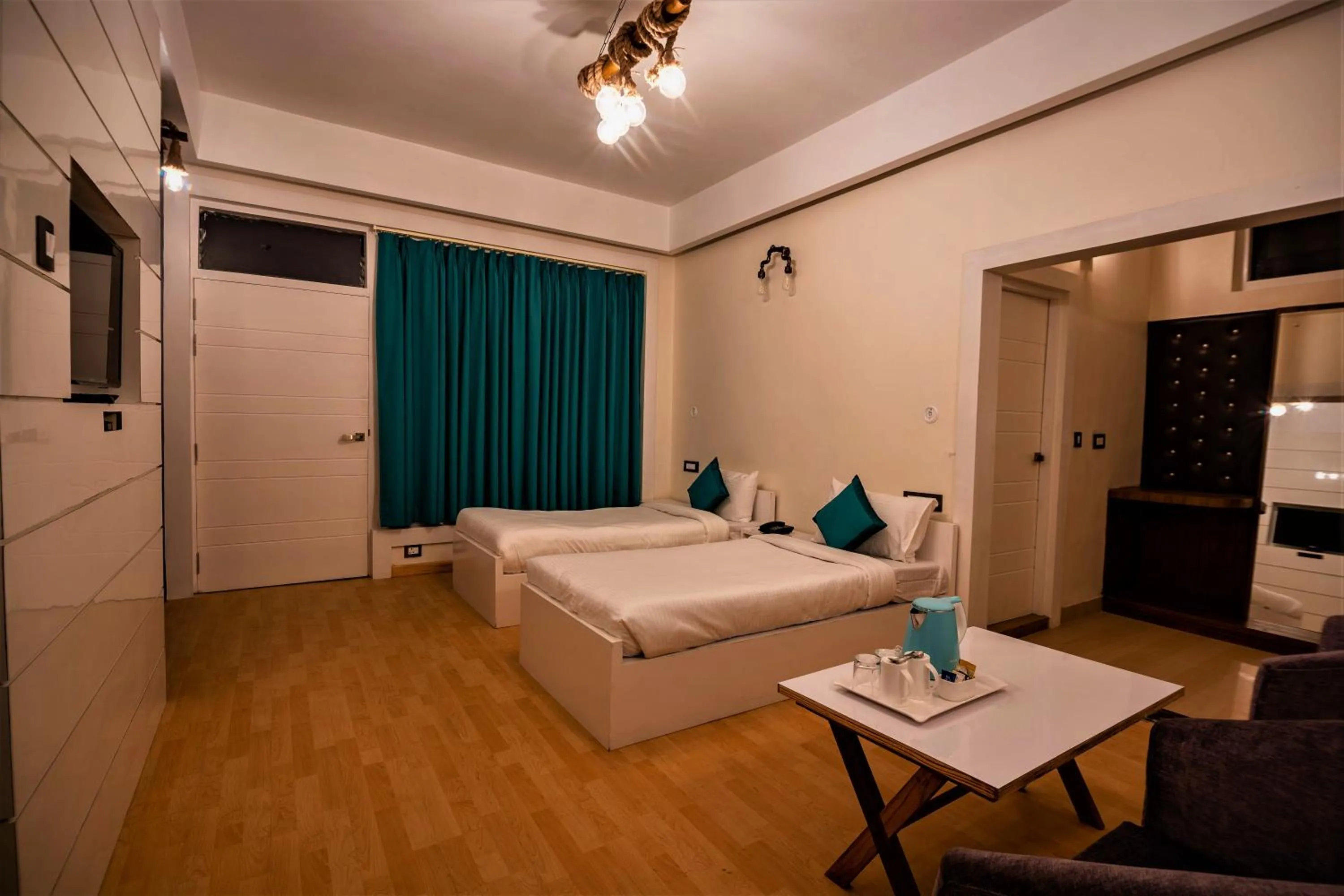 Bed in Clarks Exotica Resort Ramgarh Mukteshwar