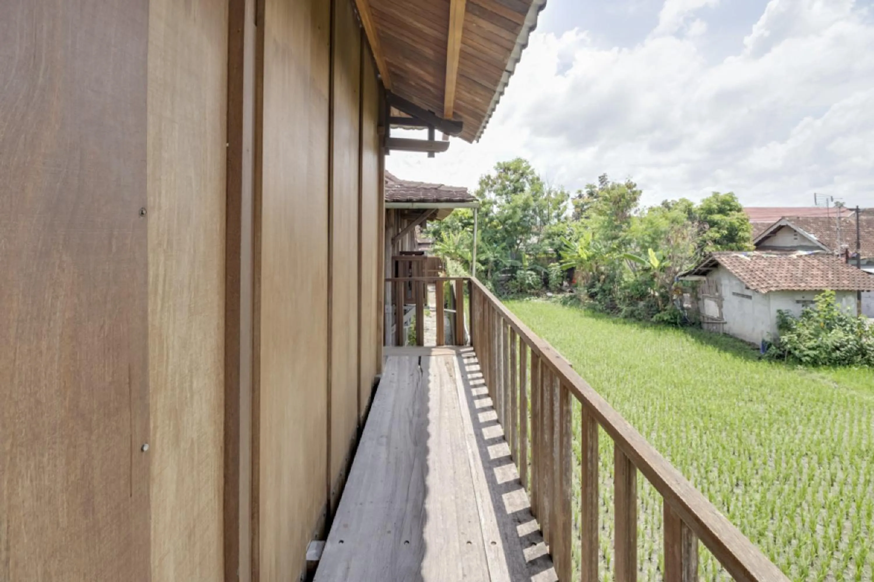 Balcony/Terrace in RedDoorz at Omah Kayu Homestay Yogyakarta