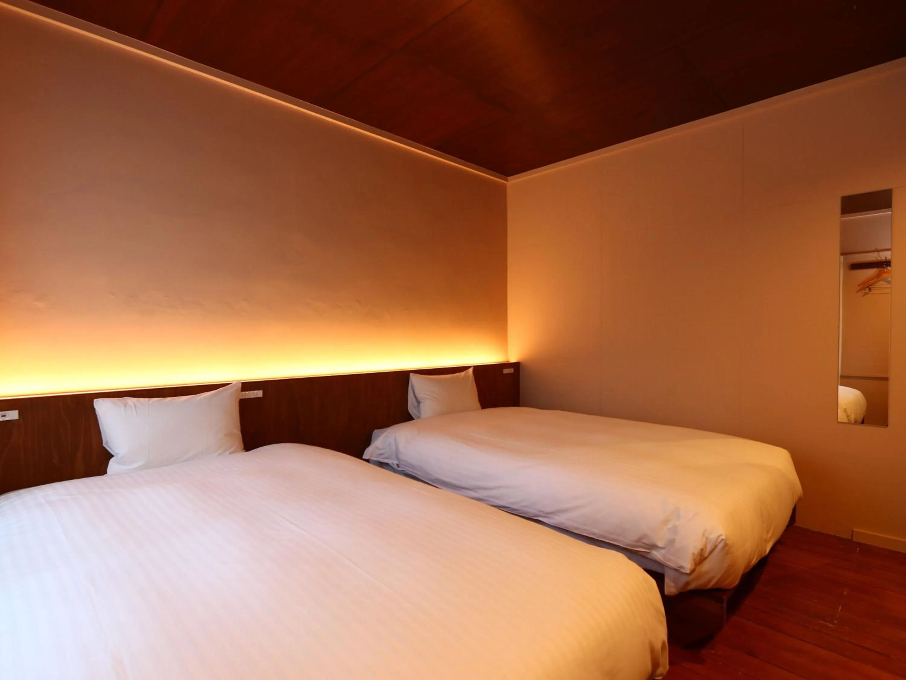 Bed in nirasakiyaSTAY