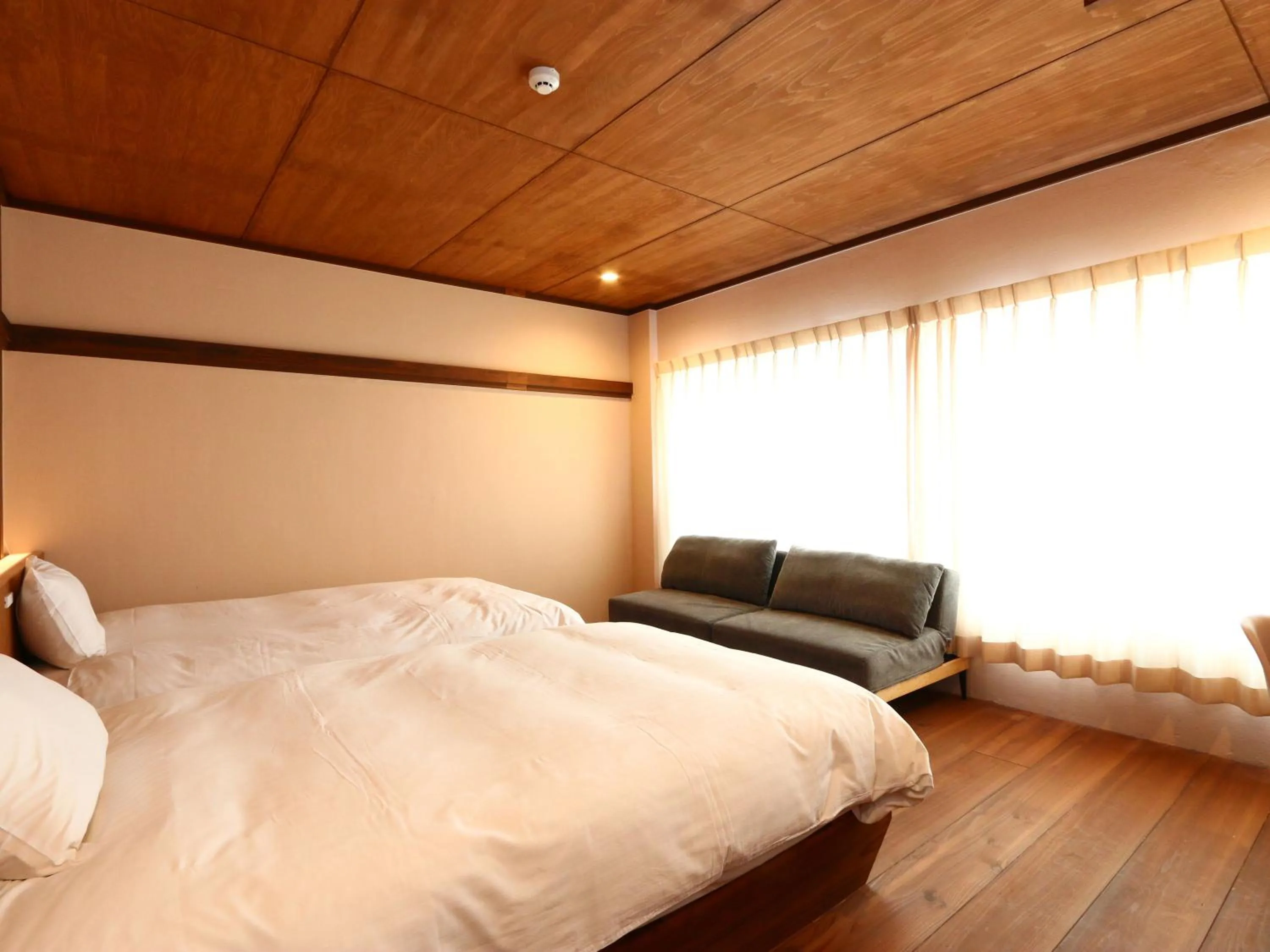 Bed in nirasakiyaSTAY