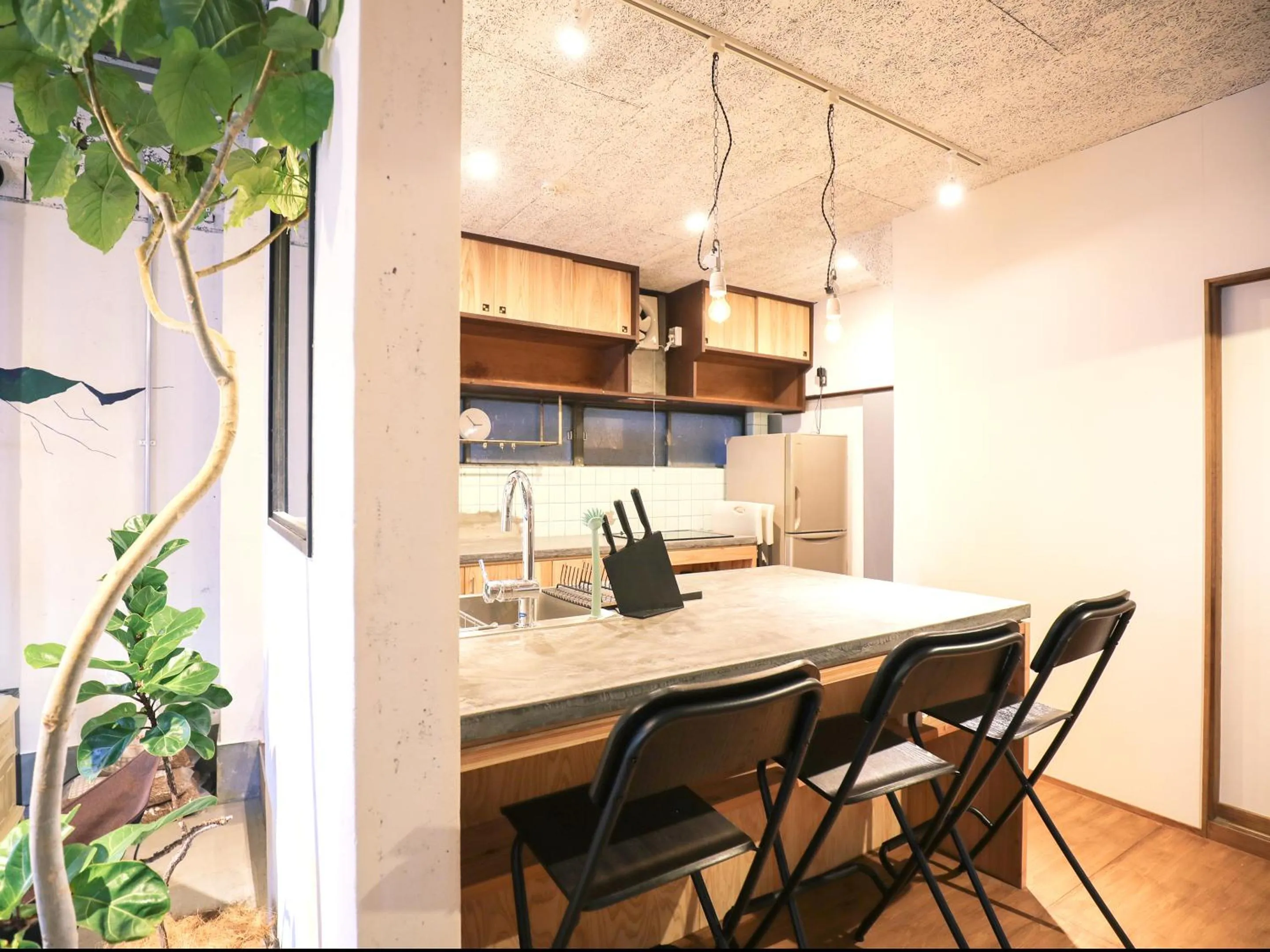 Communal kitchen in chAho Hostel Nirasaki / Outdoor Base