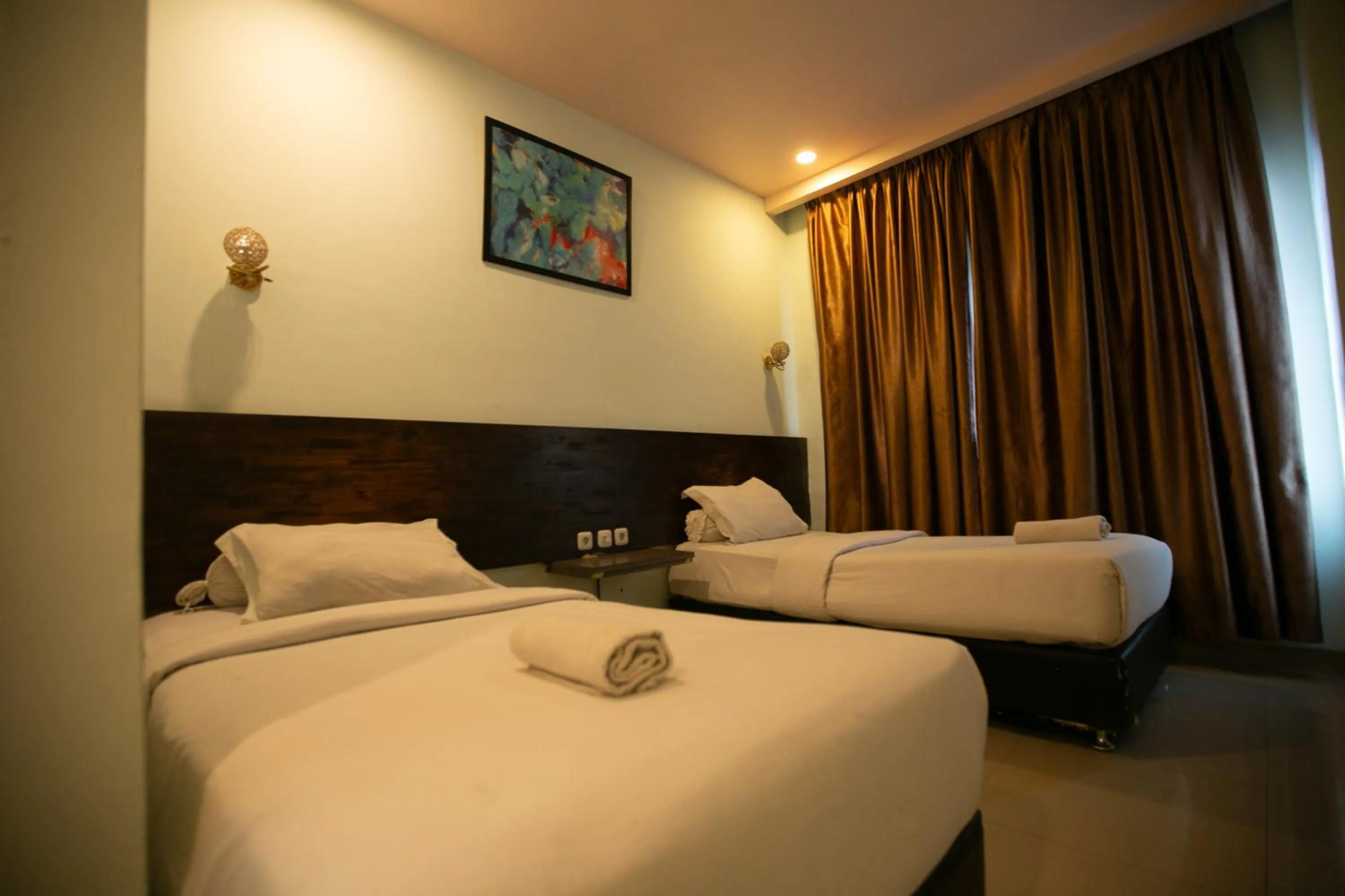 Bed in De'Tonga Hotel