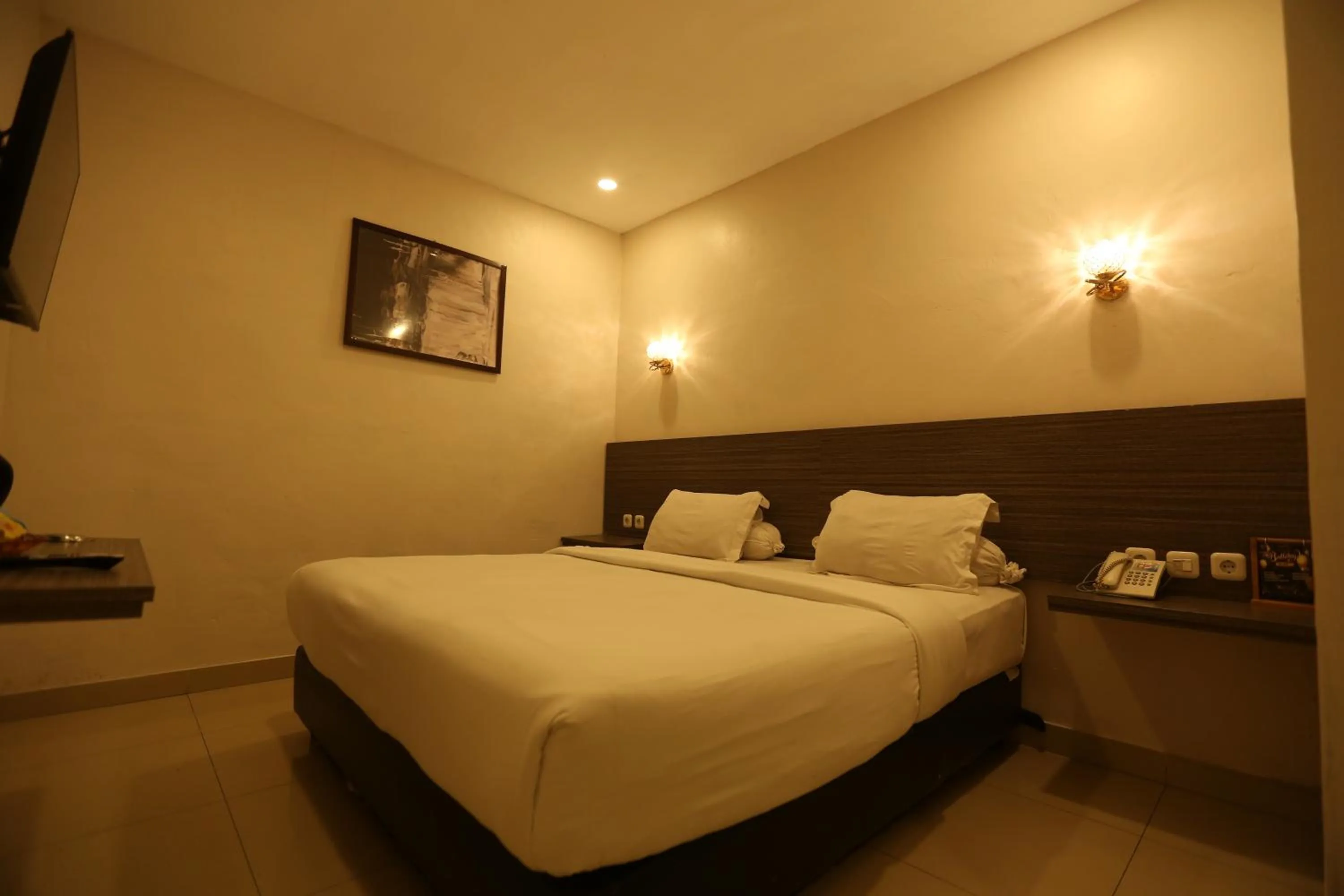 Bed in De'Tonga Hotel