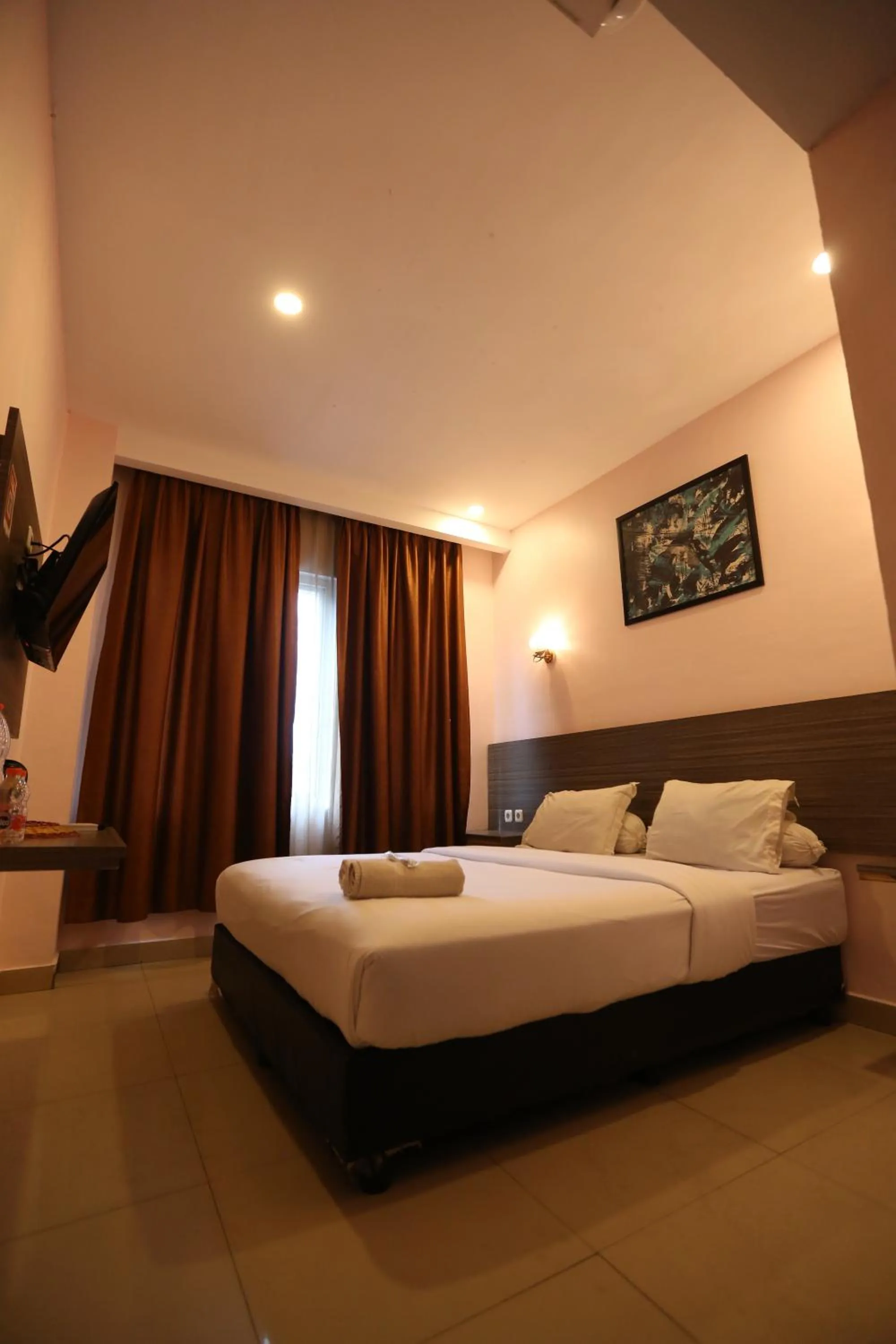 Bed in De'Tonga Hotel