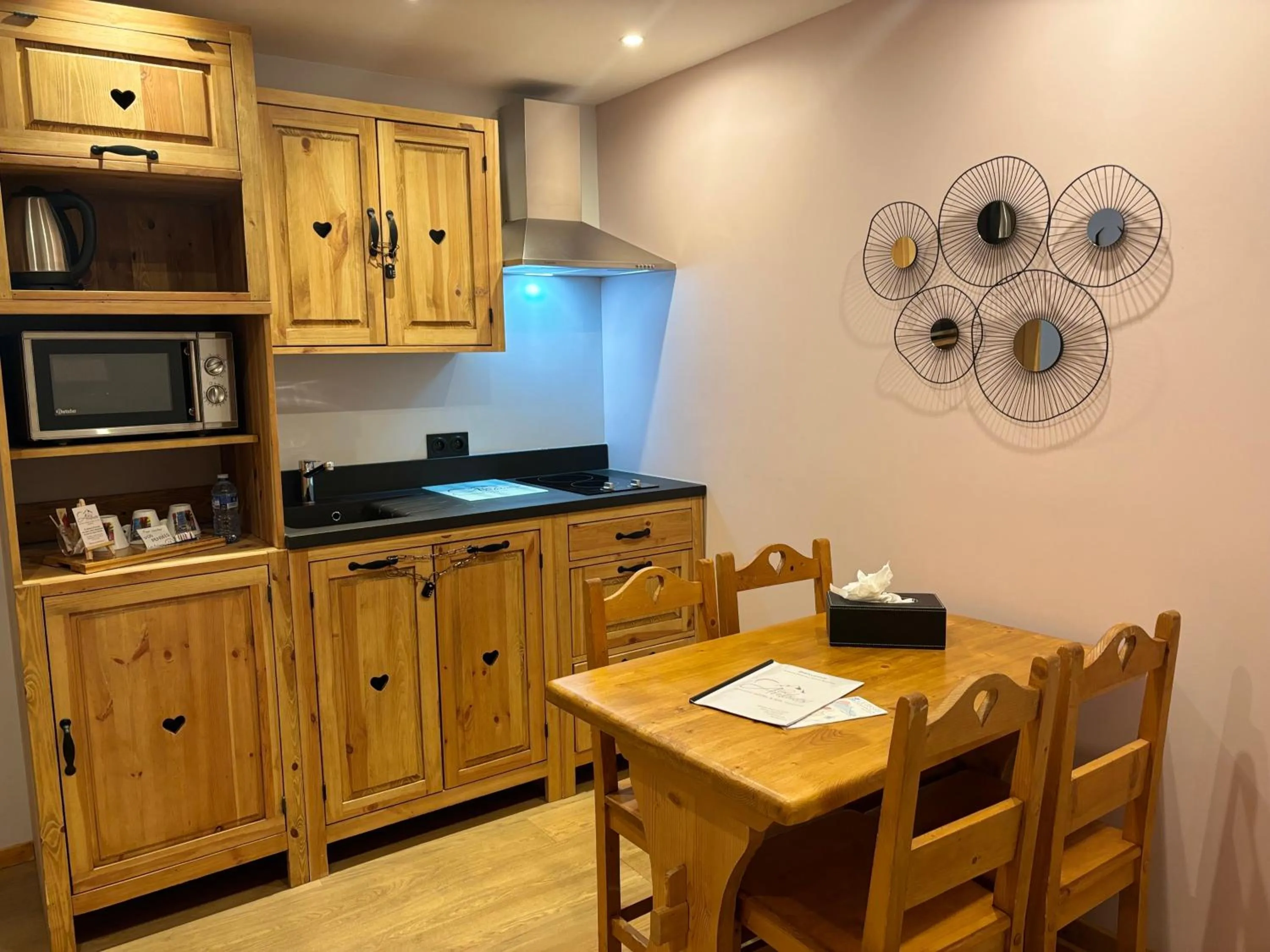 Kitchen or kitchenette in Logis Hôtel & Spa Les Autanes