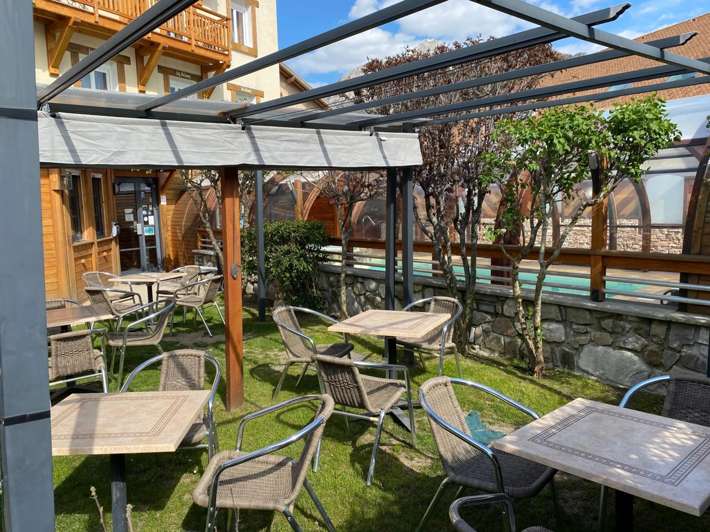 Garden in Logis Hôtel & Spa Les Autanes