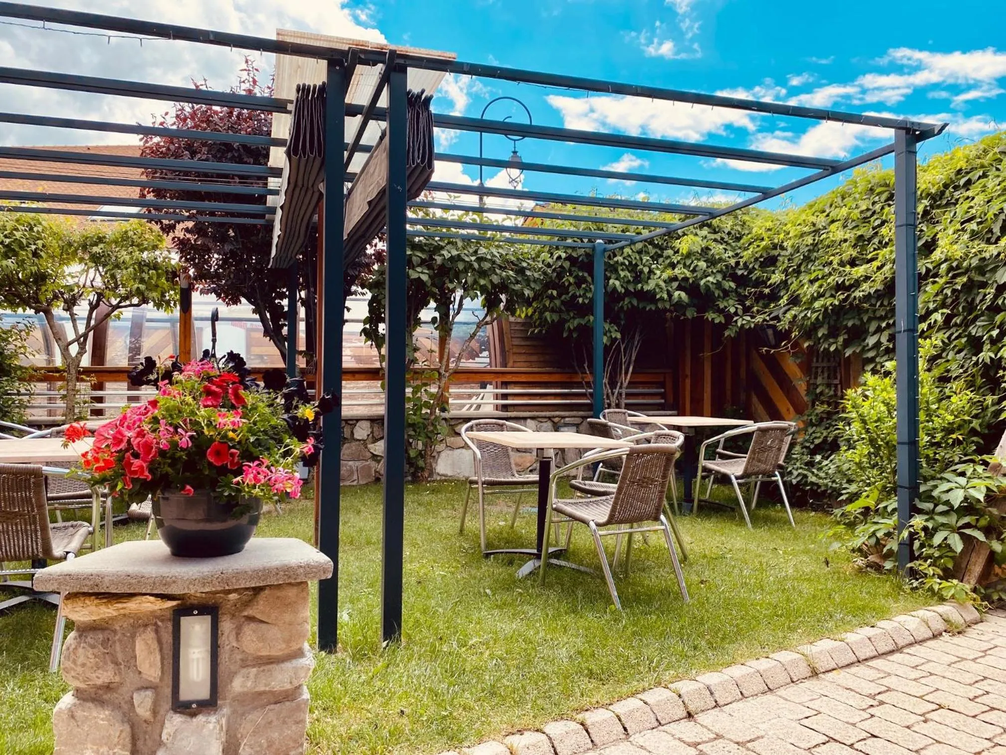 Garden in Logis Hôtel & Spa Les Autanes