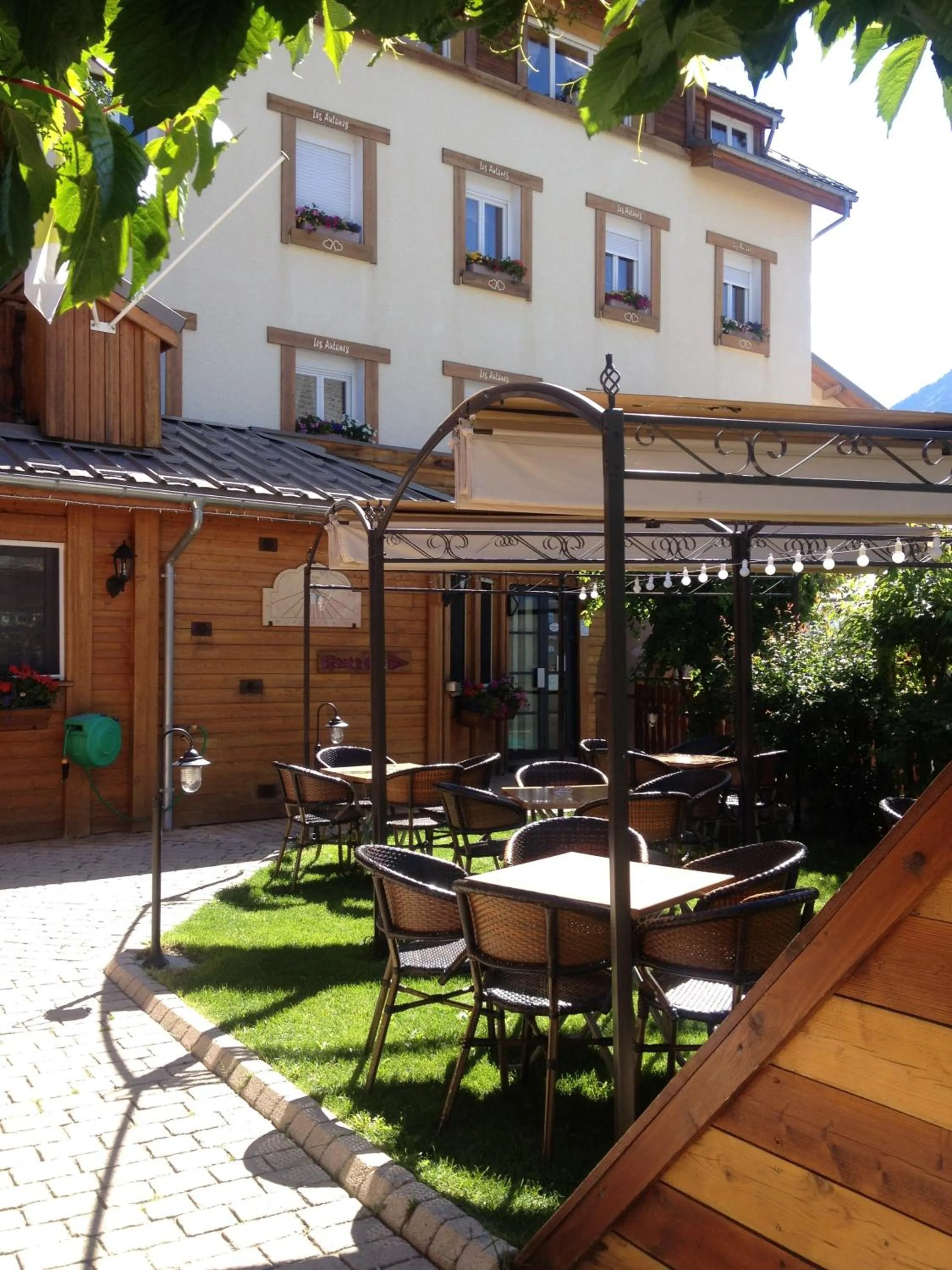 Garden view in Logis Hôtel & Spa Les Autanes