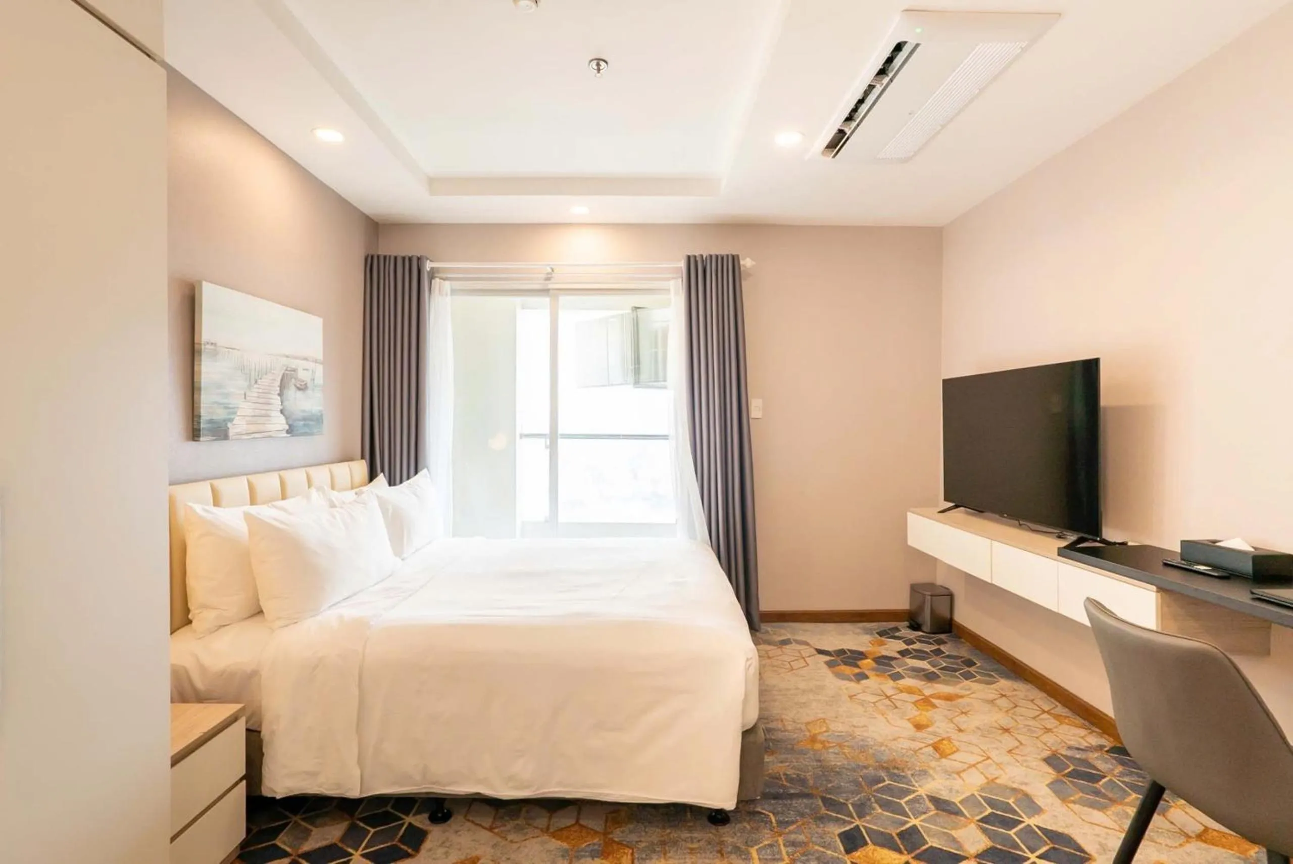 TV and multimedia, Bed in La Vela Saigon Hotel
