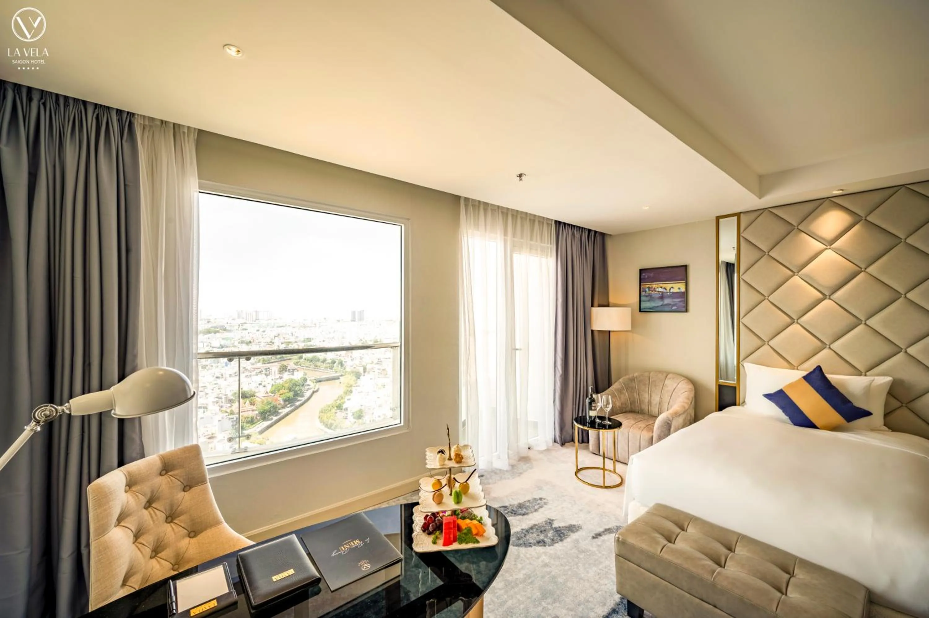 Bed in La Vela Saigon Hotel