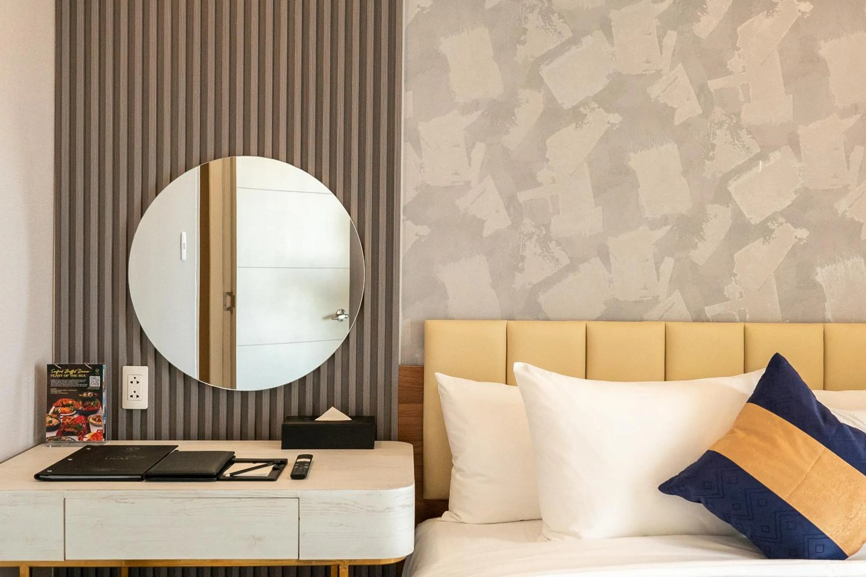 Bed in La Vela Saigon Hotel