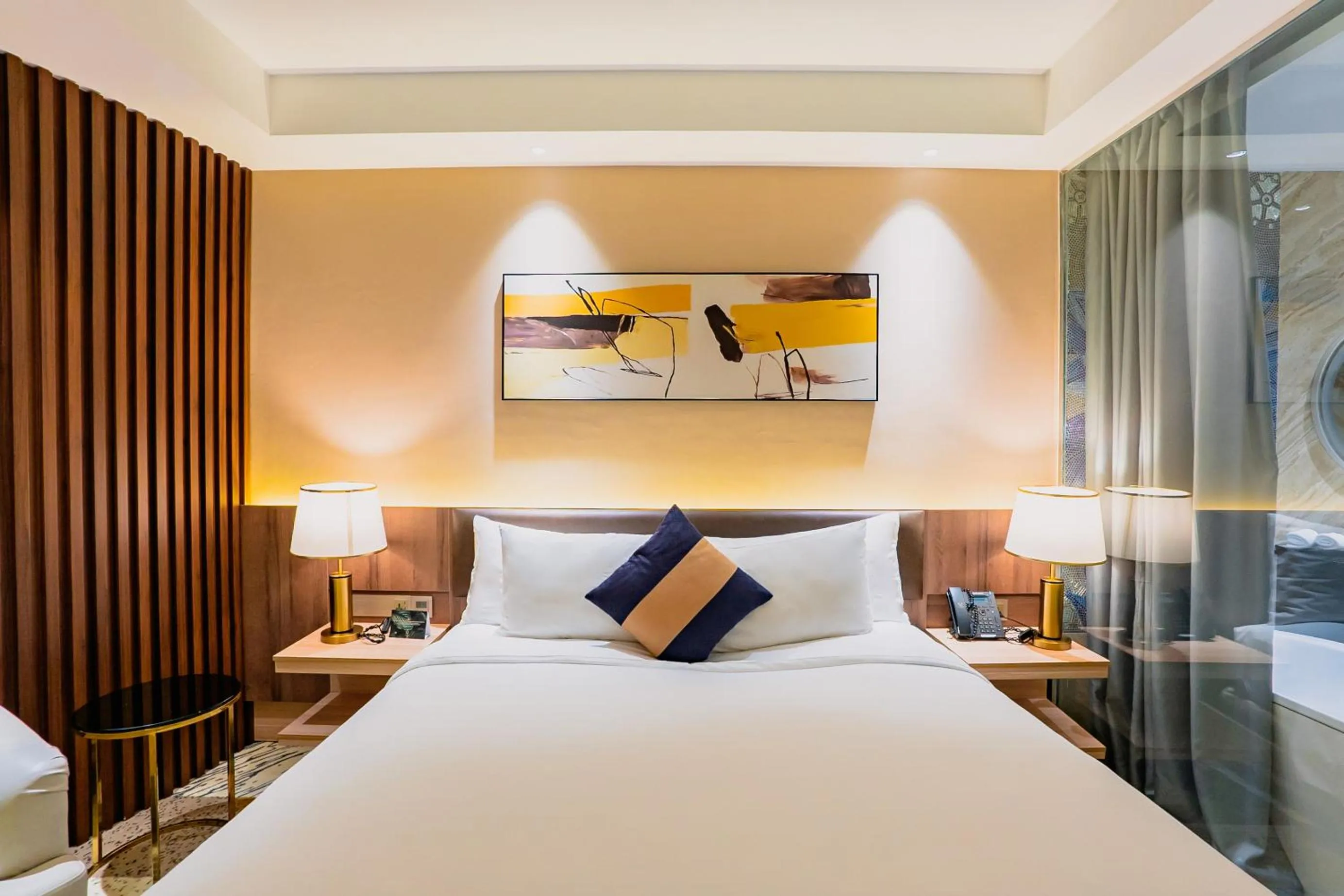 Bed in La Vela Saigon Hotel