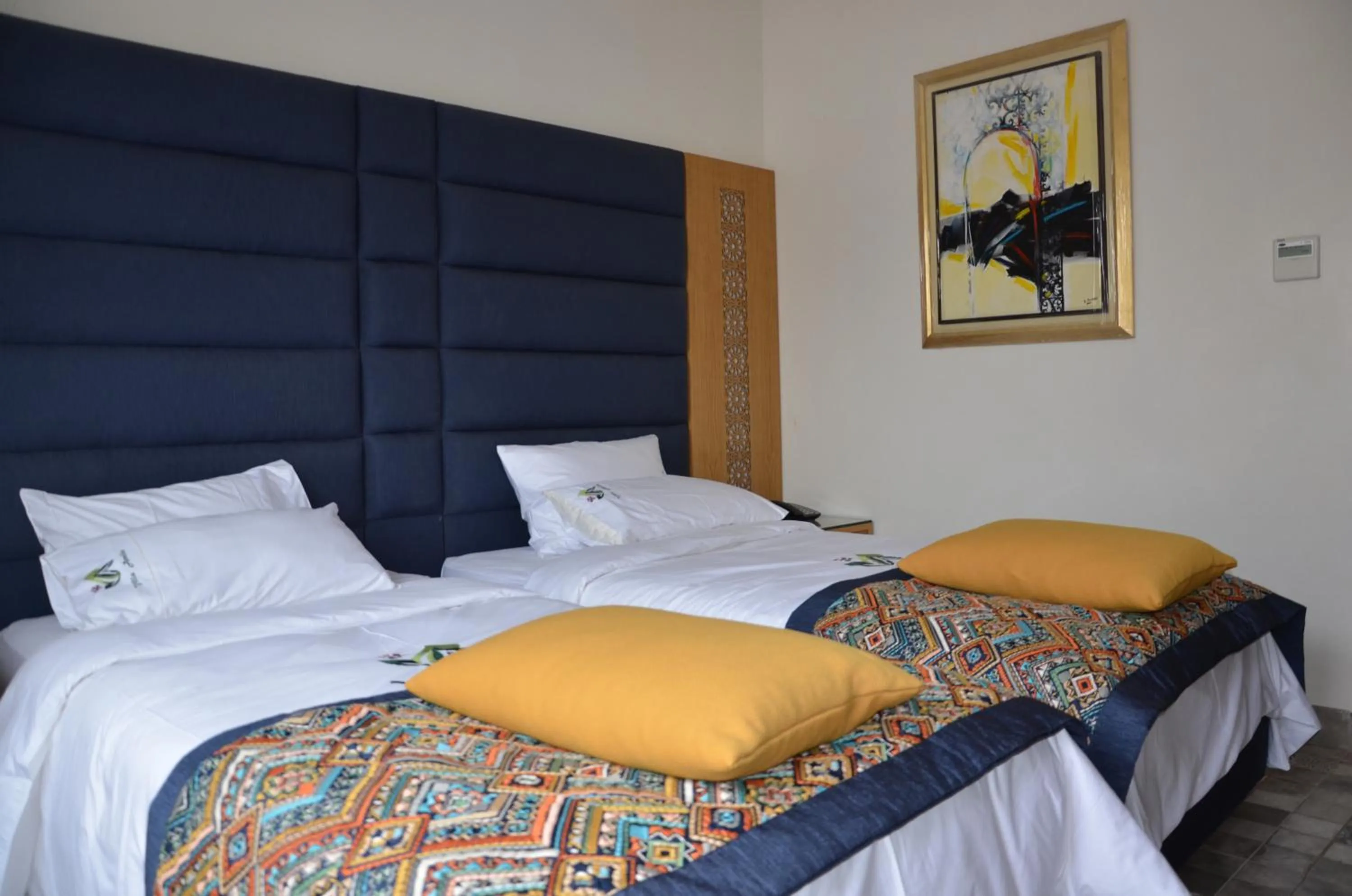 Bed in Aralia Boutique Hôtel