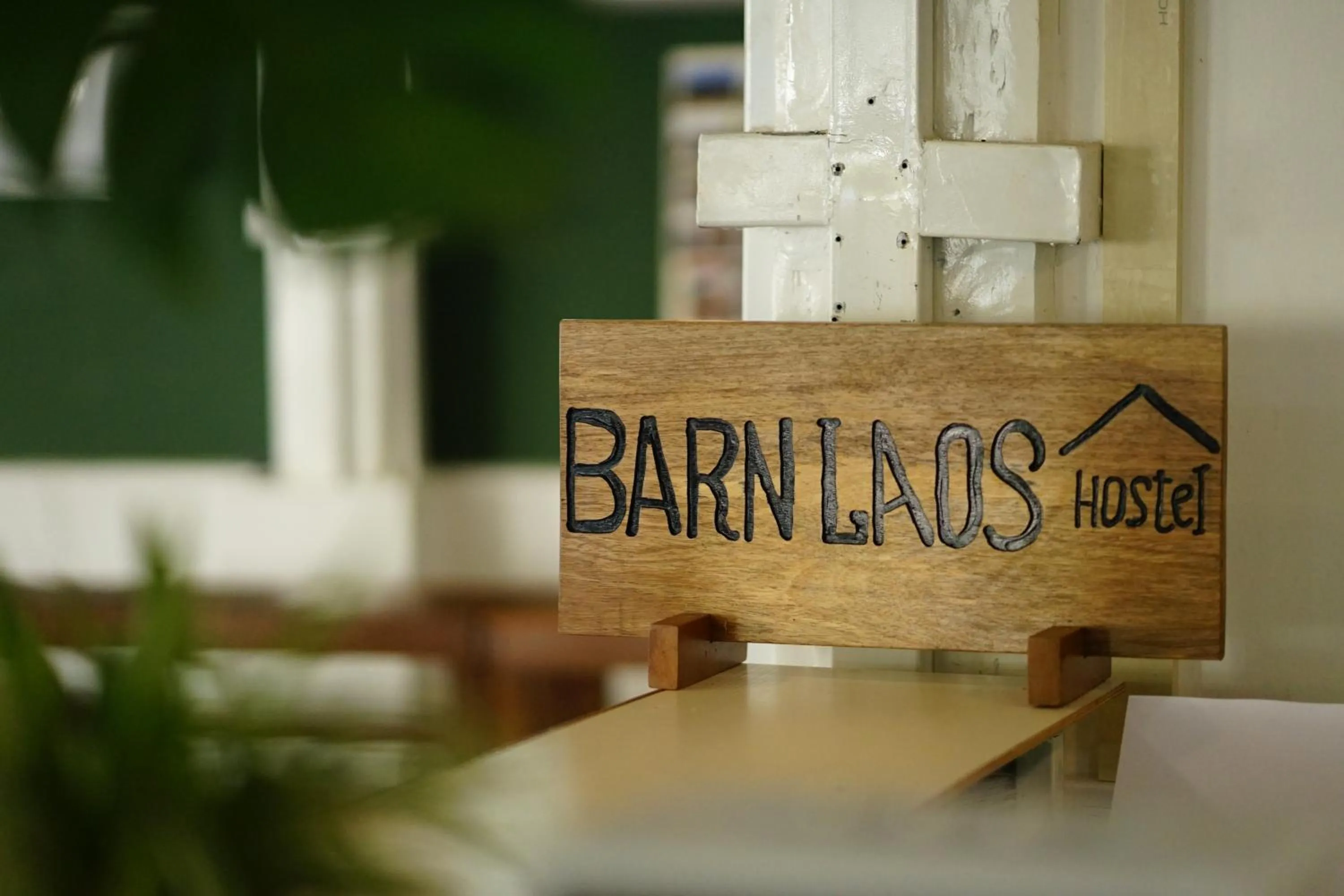 Property logo or sign in Barn Laos Hostel