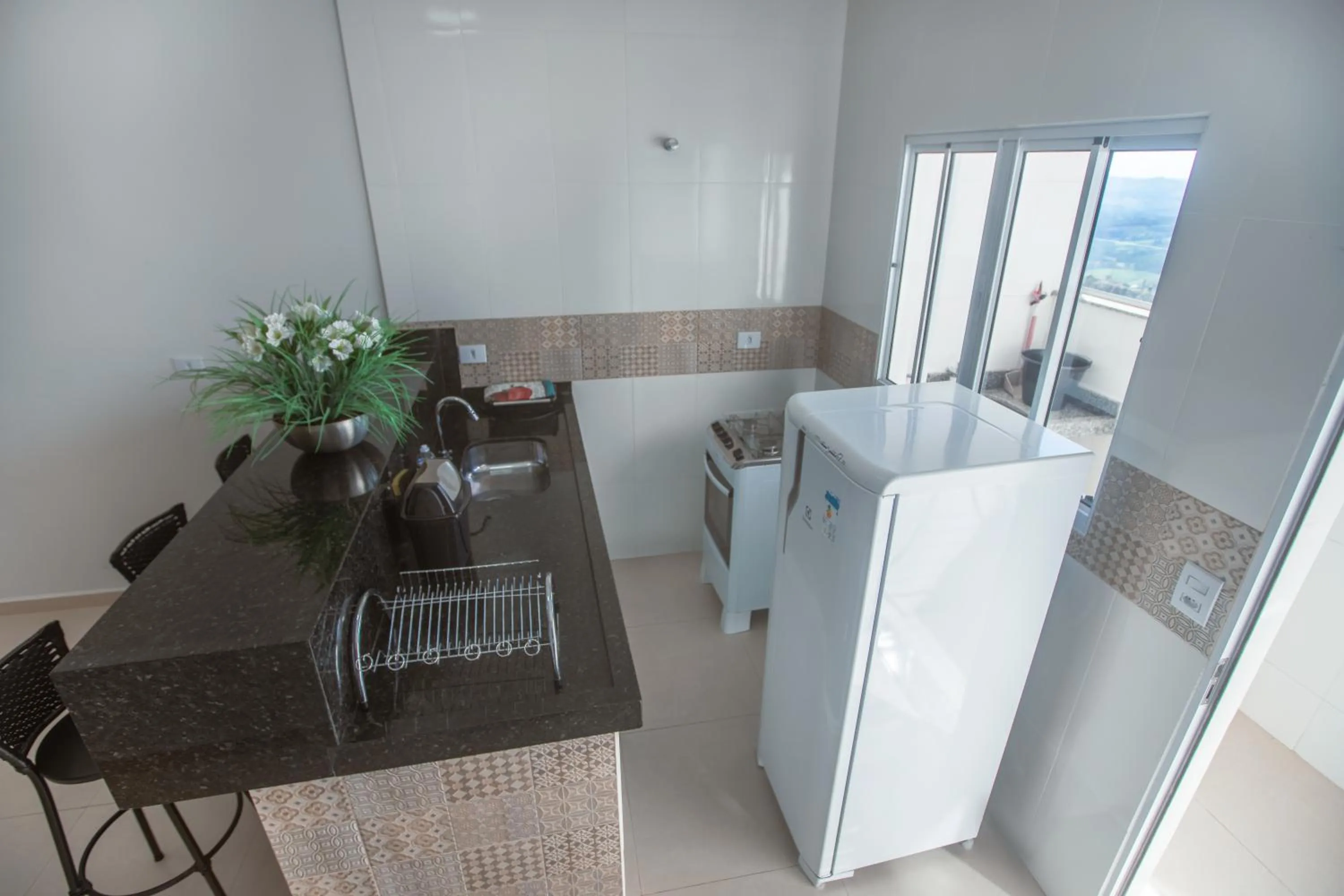 Communal kitchen in Souza Reis Apart - Unidade 1