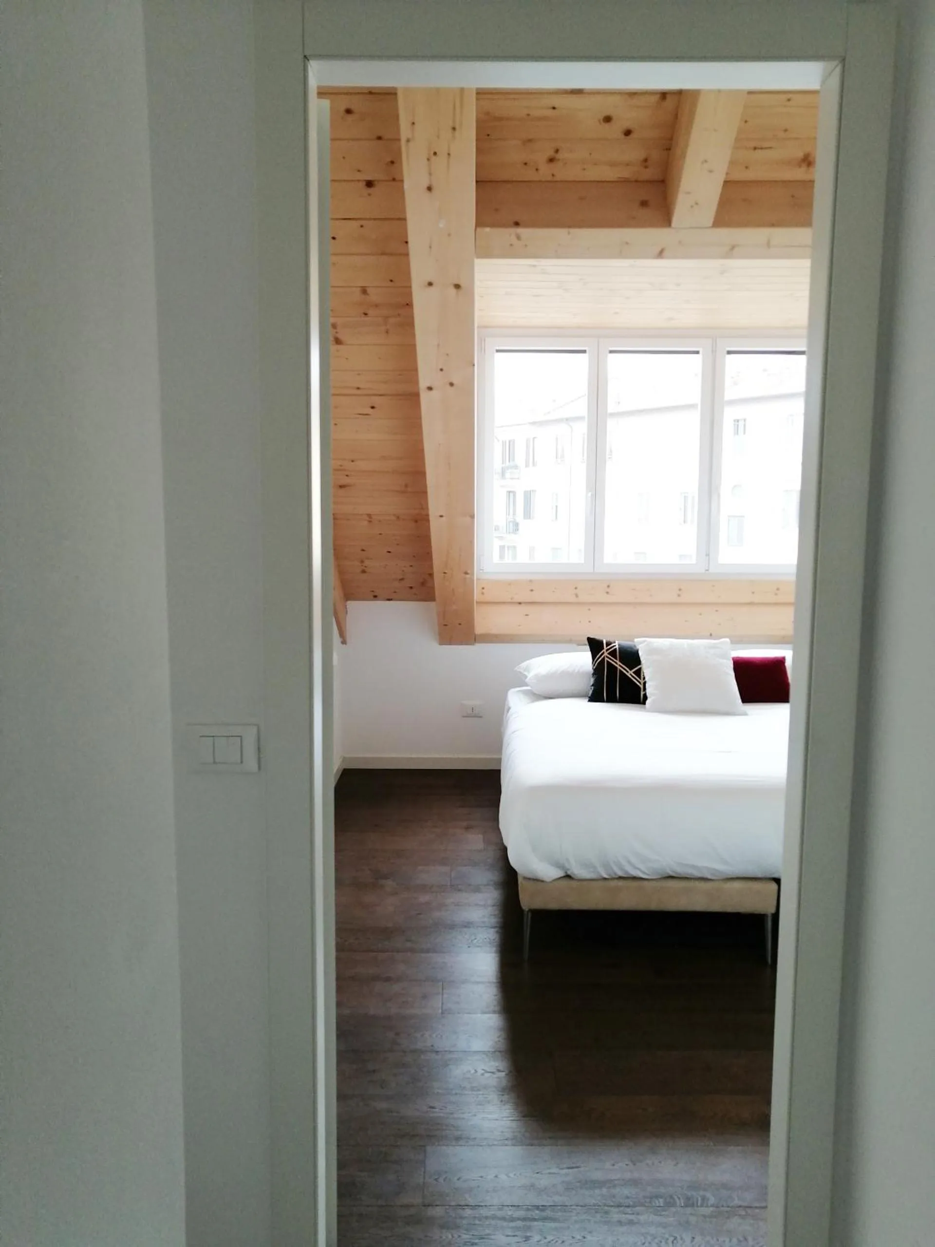 Bed in JOIVY Boutique Apartments Farneti