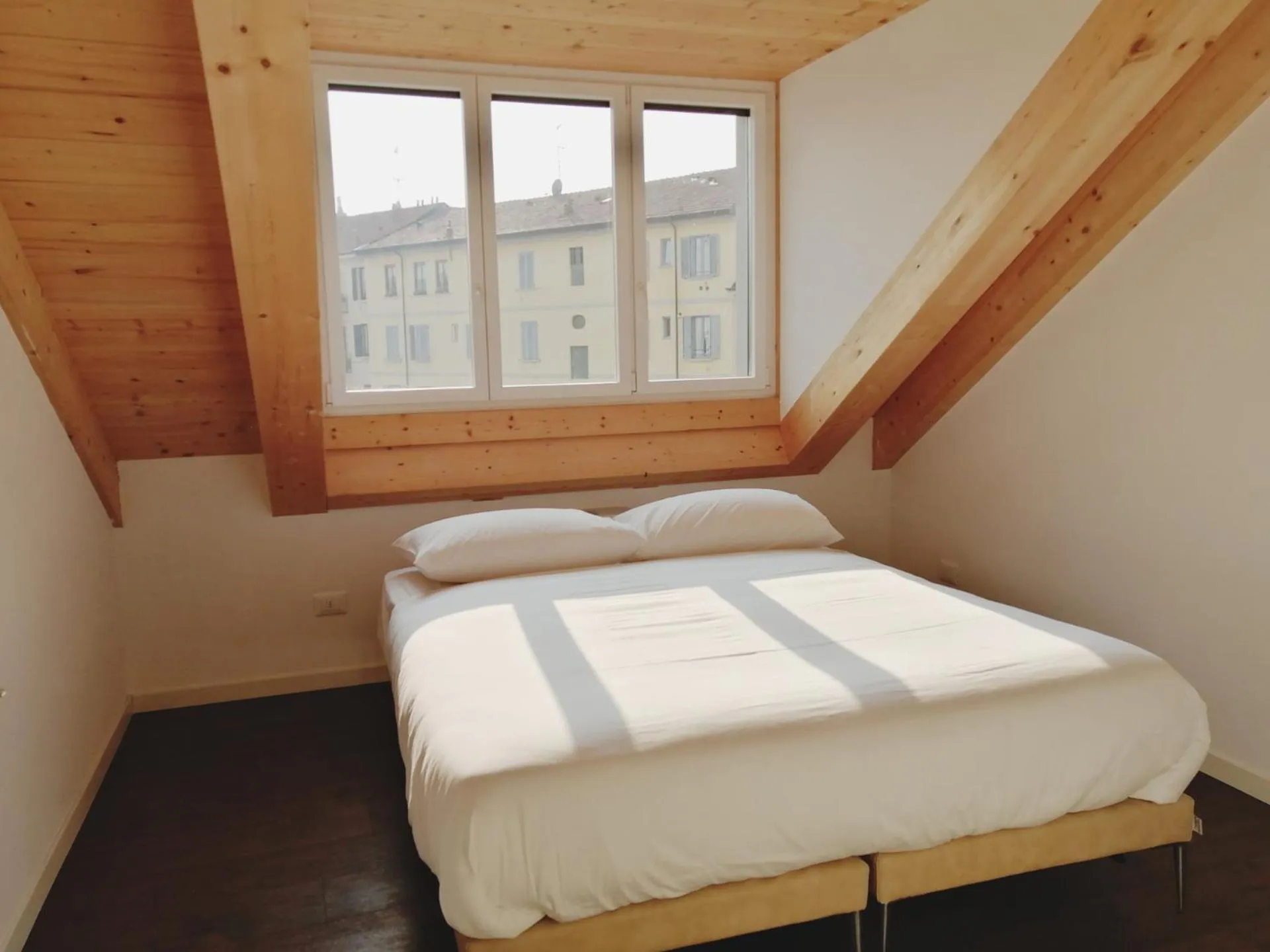 Bed in JOIVY Boutique Apartments Farneti