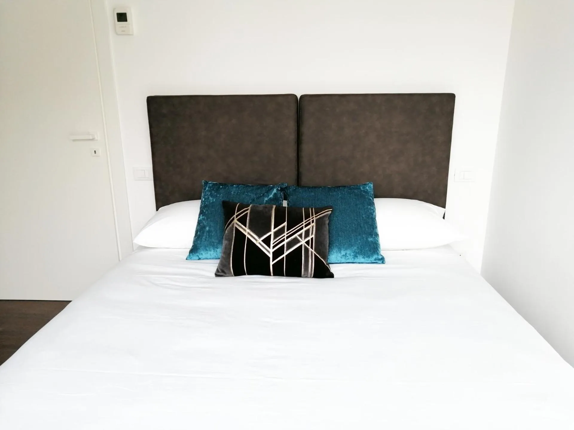 Bed in JOIVY Boutique Apartments Farneti