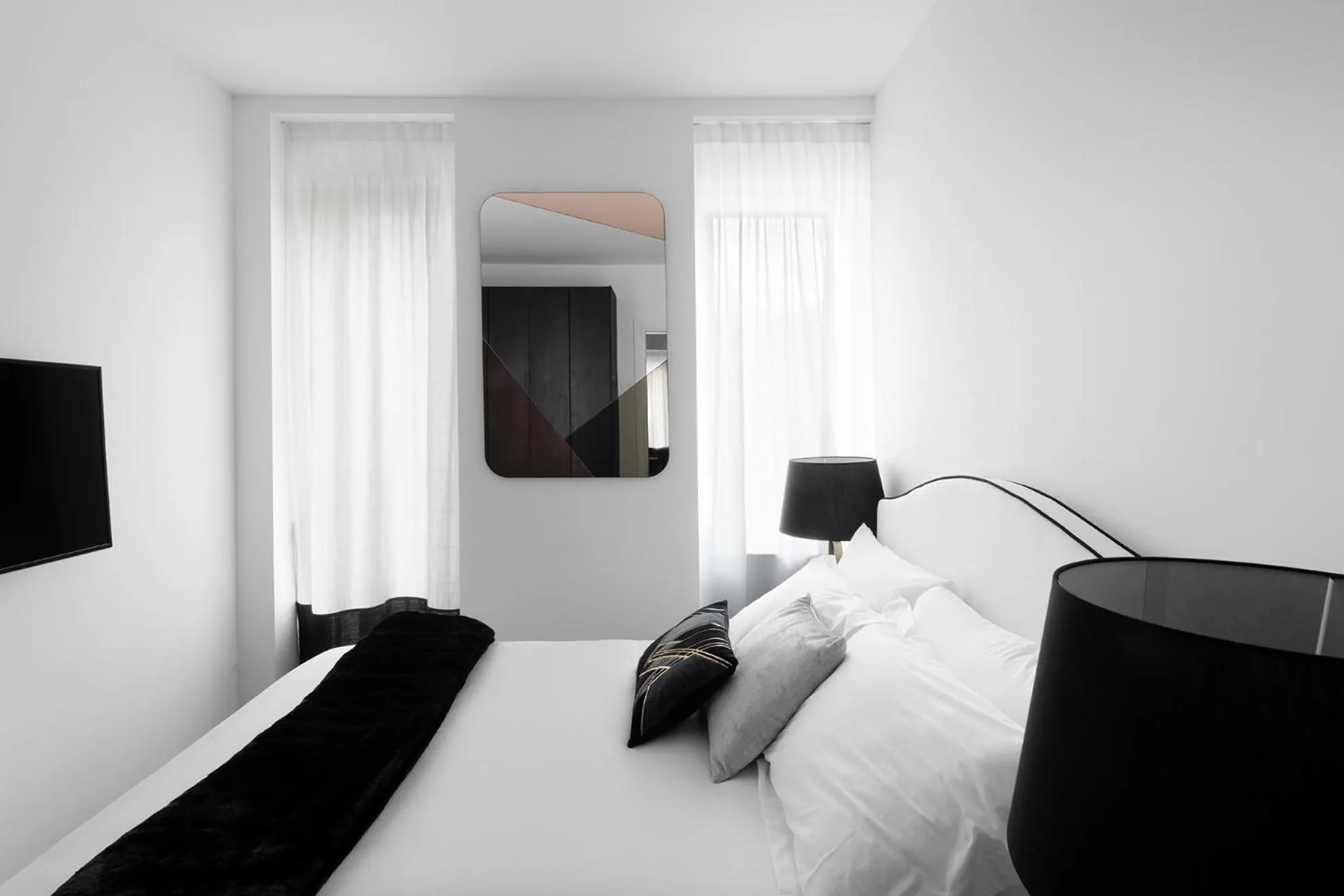 Bed in JOIVY Boutique Apartments Farneti