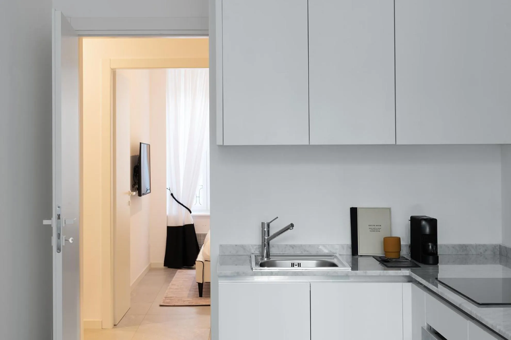 Kitchen or kitchenette in JOIVY Boutique Apartments Farneti