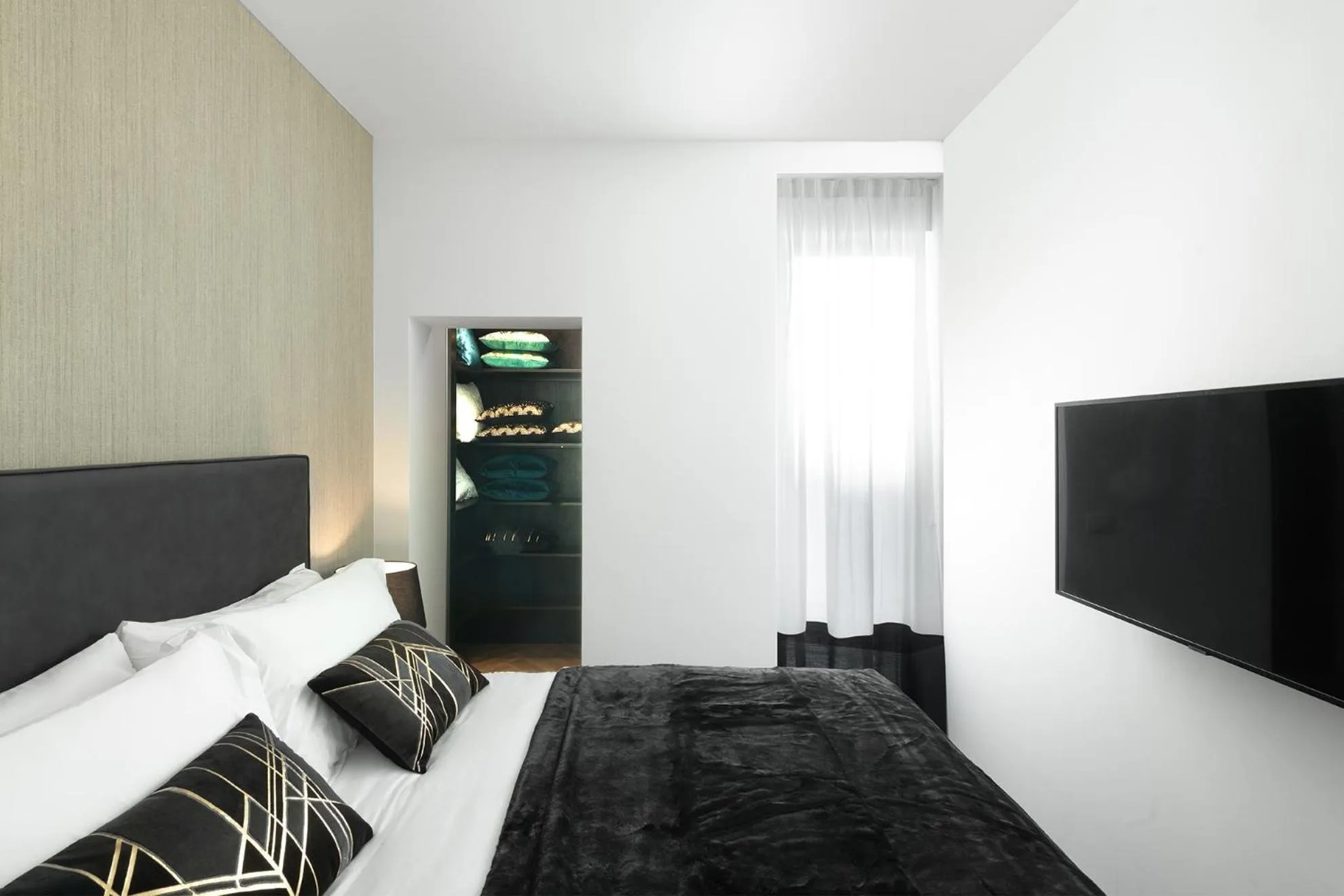 Bed in JOIVY Boutique Apartments Farneti