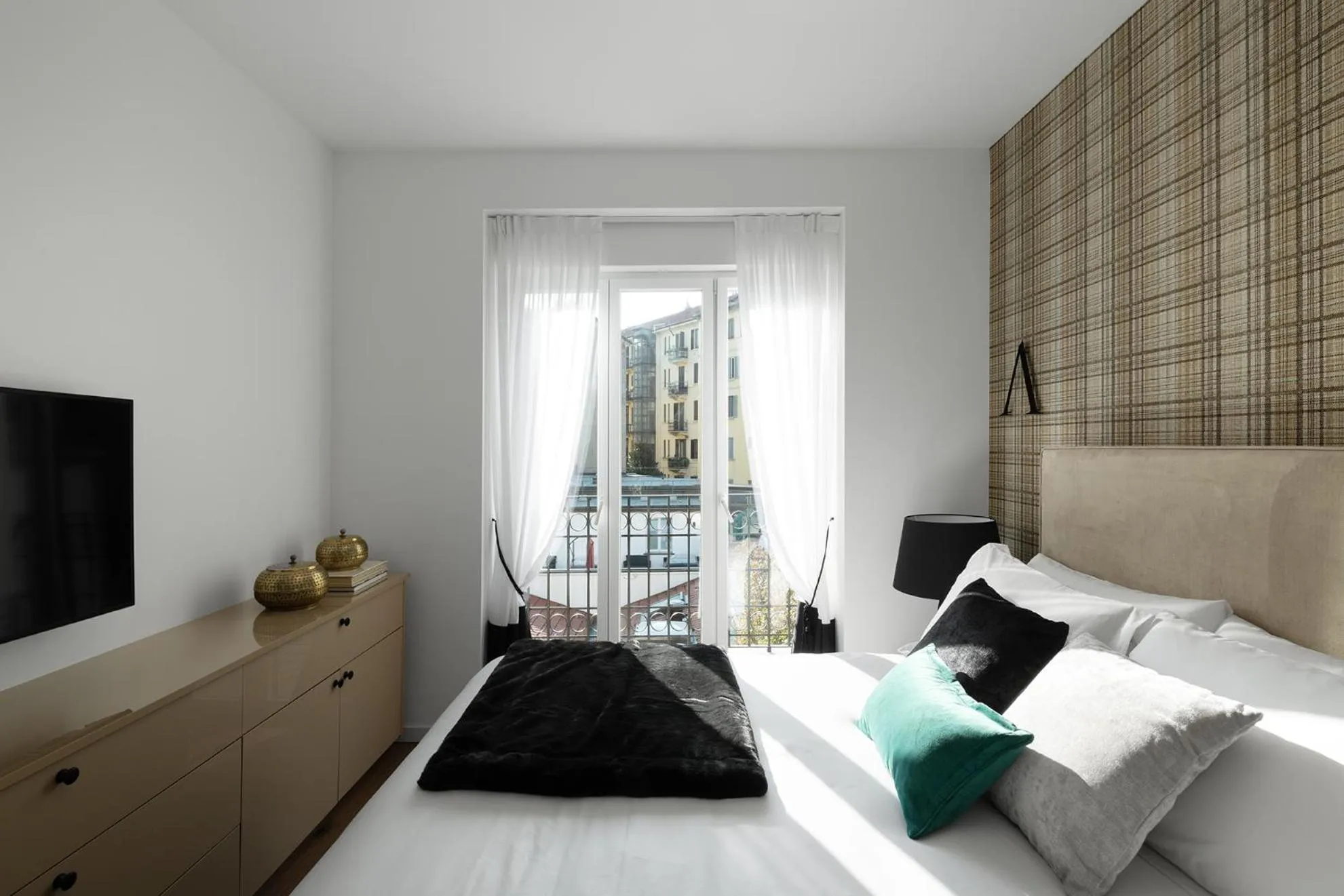 Bed in JOIVY Boutique Apartments Farneti