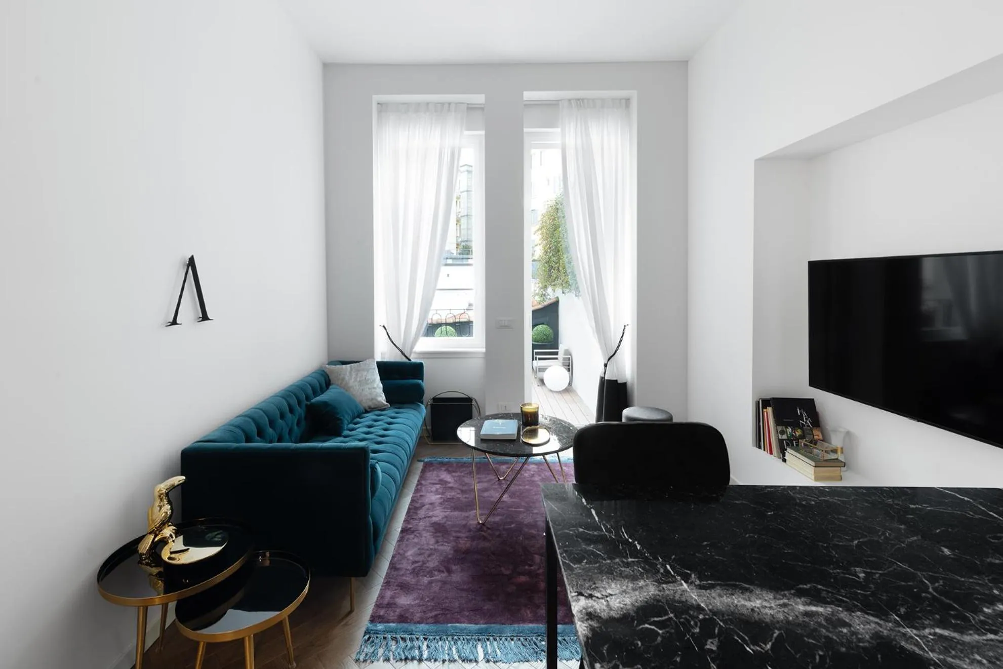 TV and multimedia in JOIVY Boutique Apartments Farneti