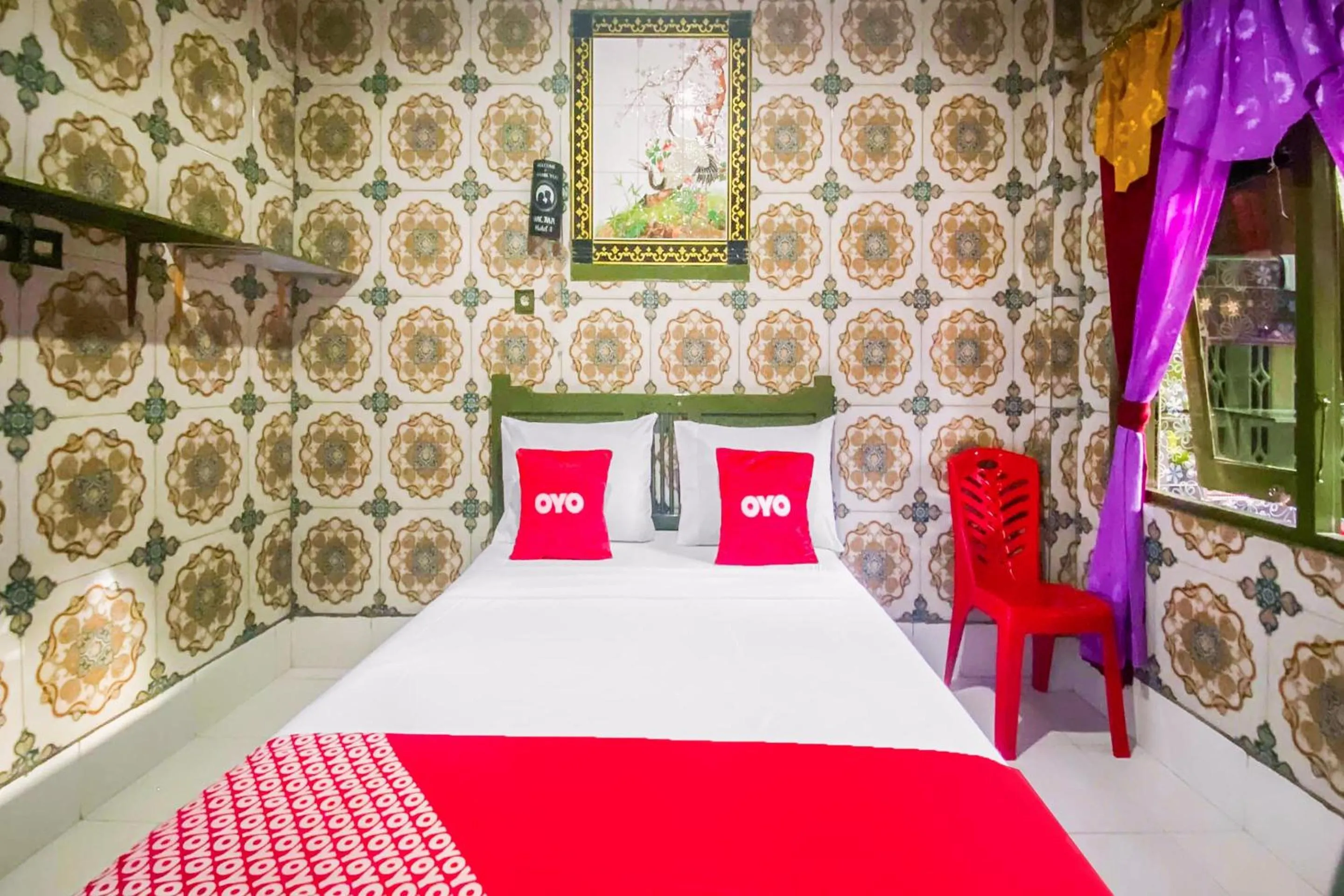 Bedroom in OYO 2518 Wilma Hotel Ii Premier