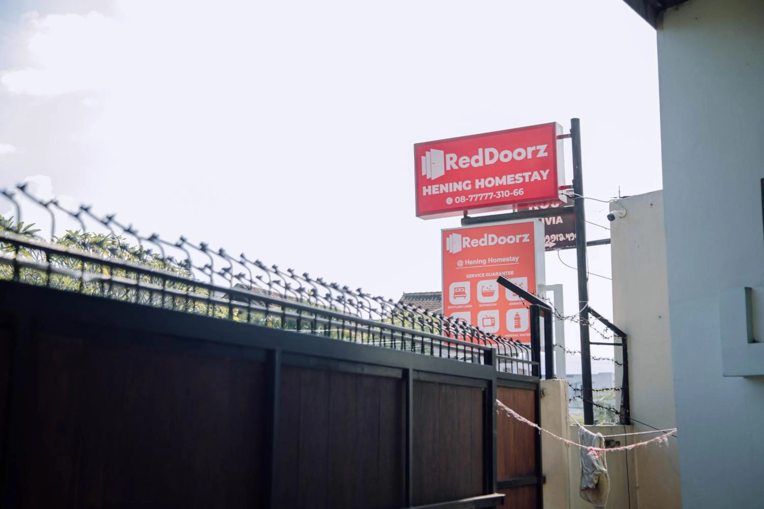 Property logo or sign in RedDoorz at Hening Homestay