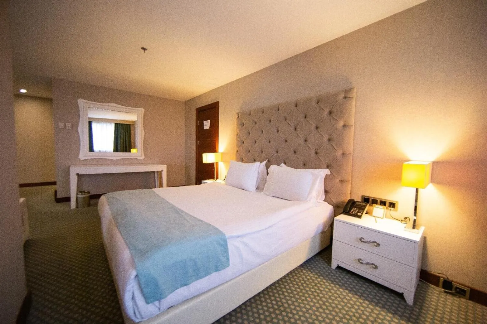 Bed in Nevali Hotel & Convention Center