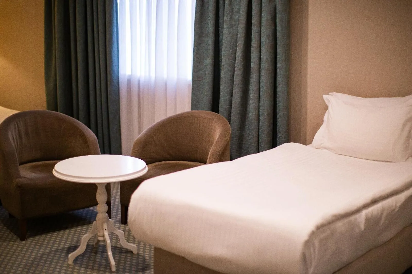 Bed in Nevali Hotel & Convention Center