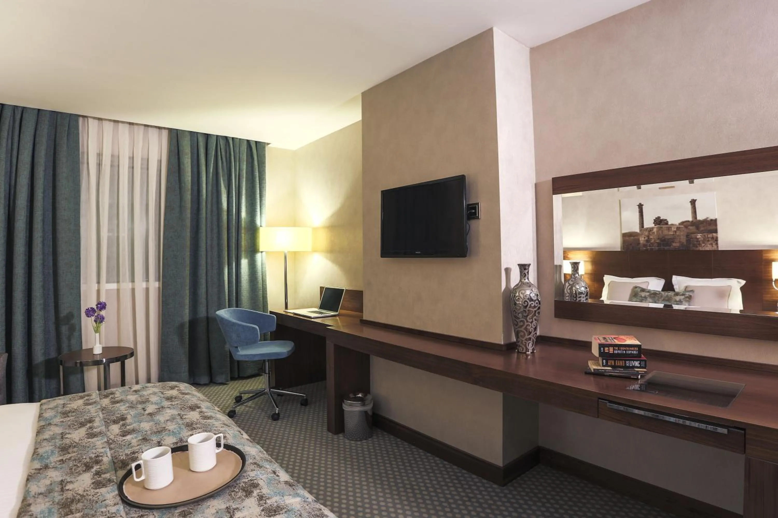 Communal lounge/ TV room, Bed in Nevali Hotel & Convention Center