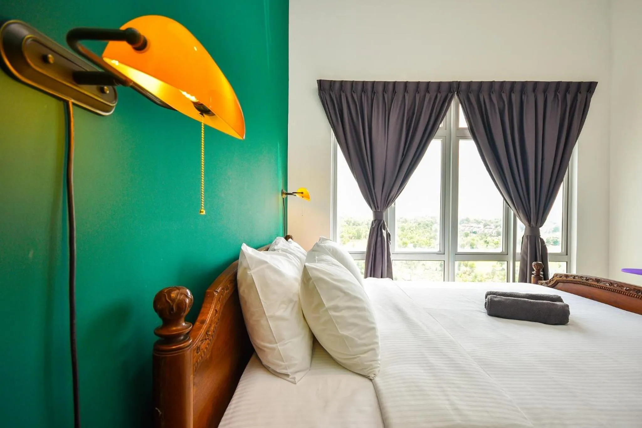 Bed in Manhattan Theme Suite by Nest Home at Austin Heights