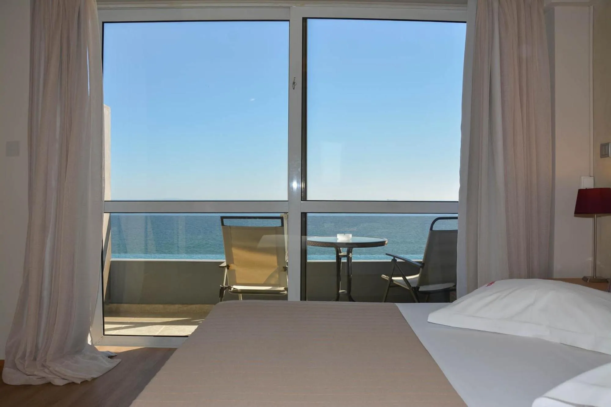 Bed in Scorpios Sea Side Hotel