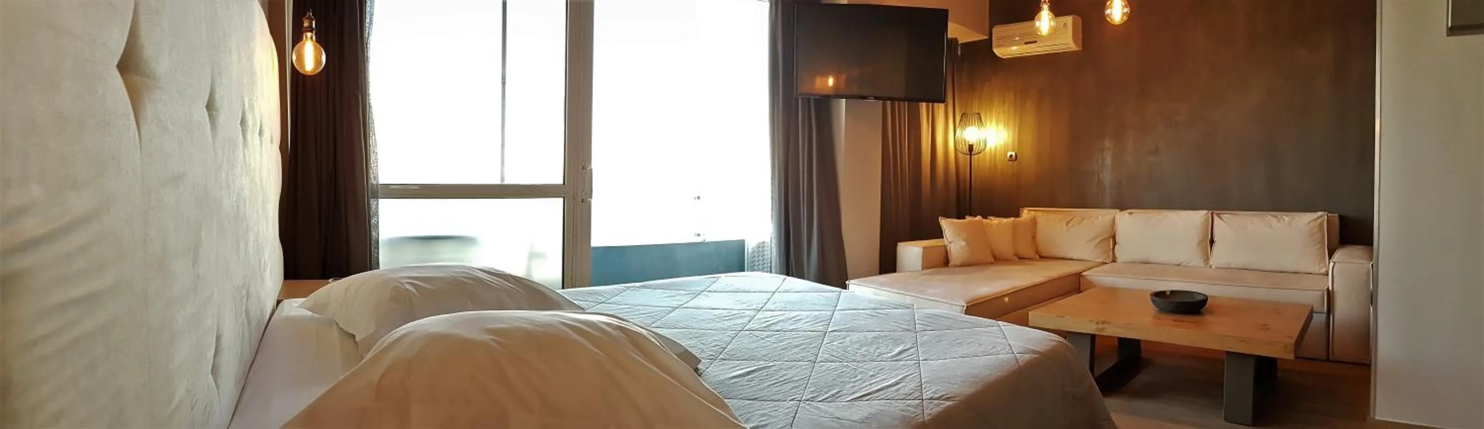 Bed in Scorpios Sea Side Hotel