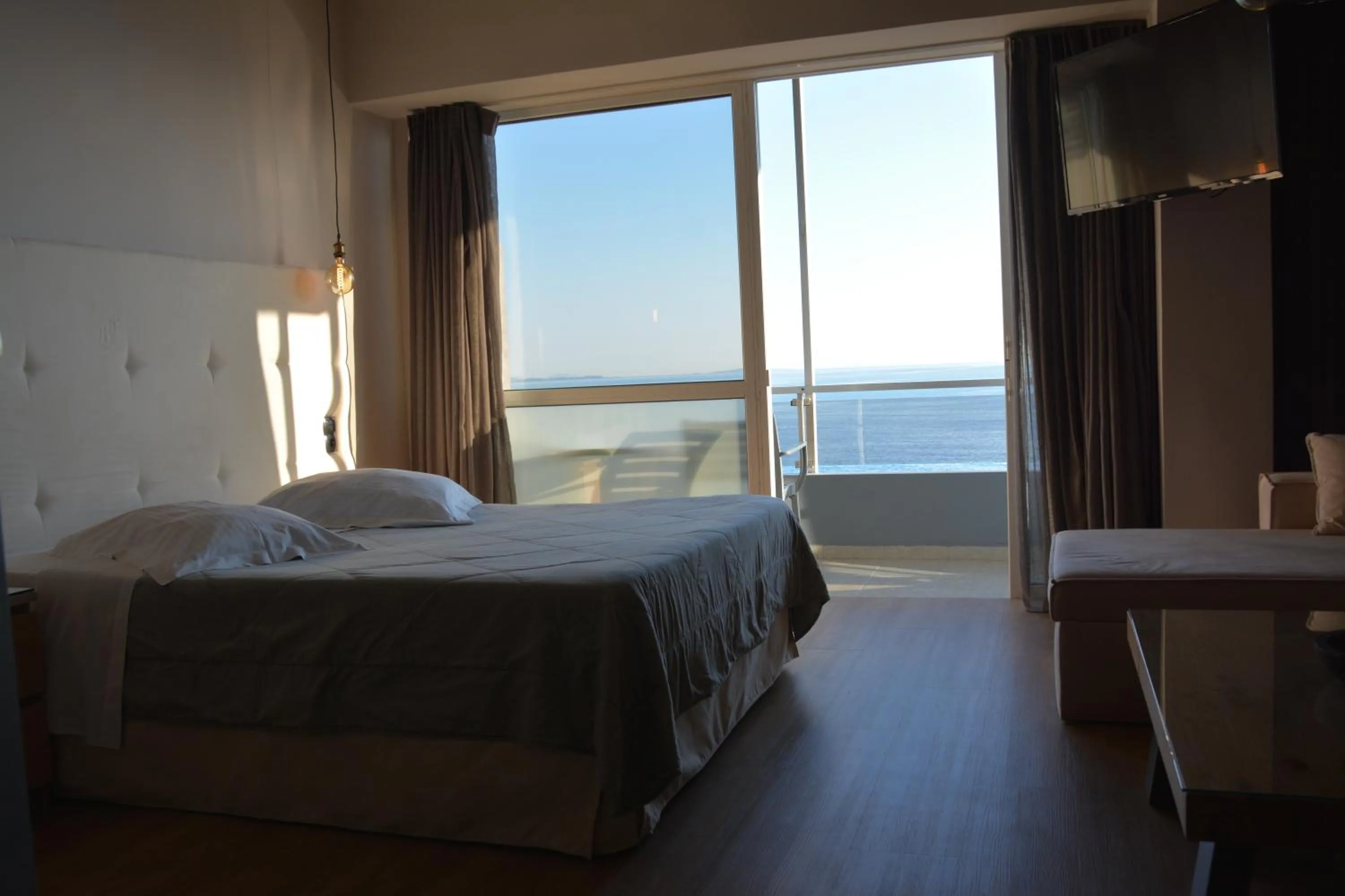 Bed in Scorpios Sea Side Hotel